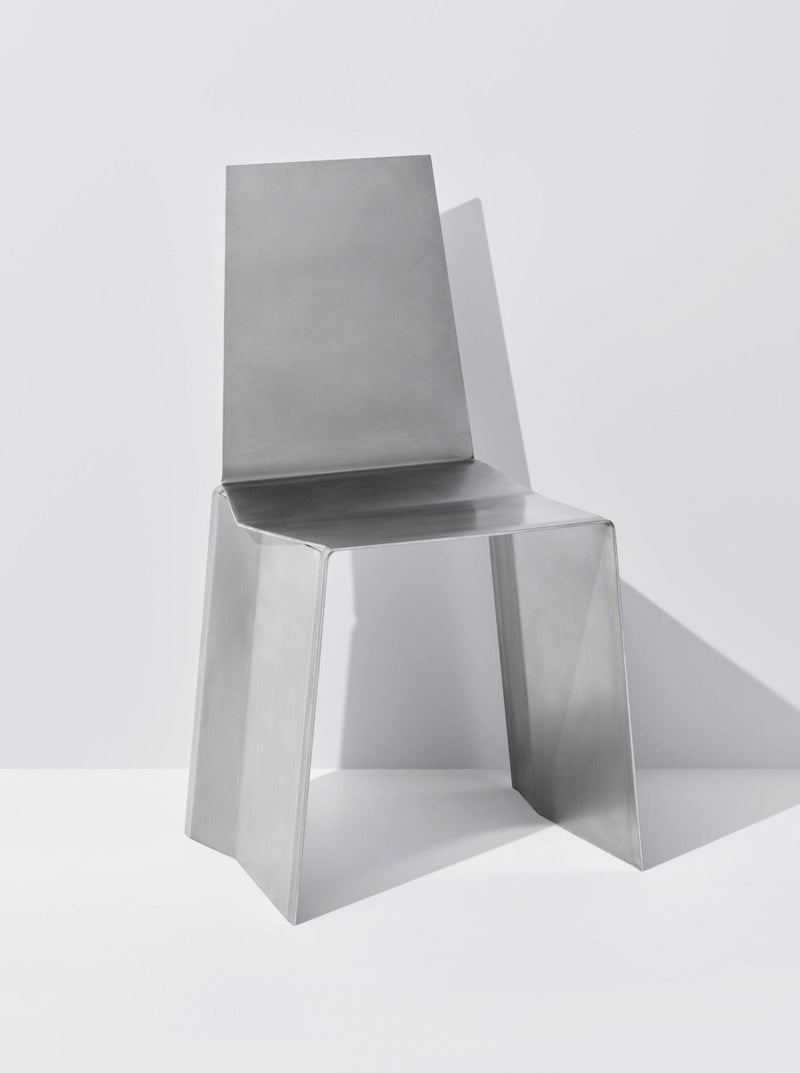 Modern aluminum Camber chair with angular geometric base