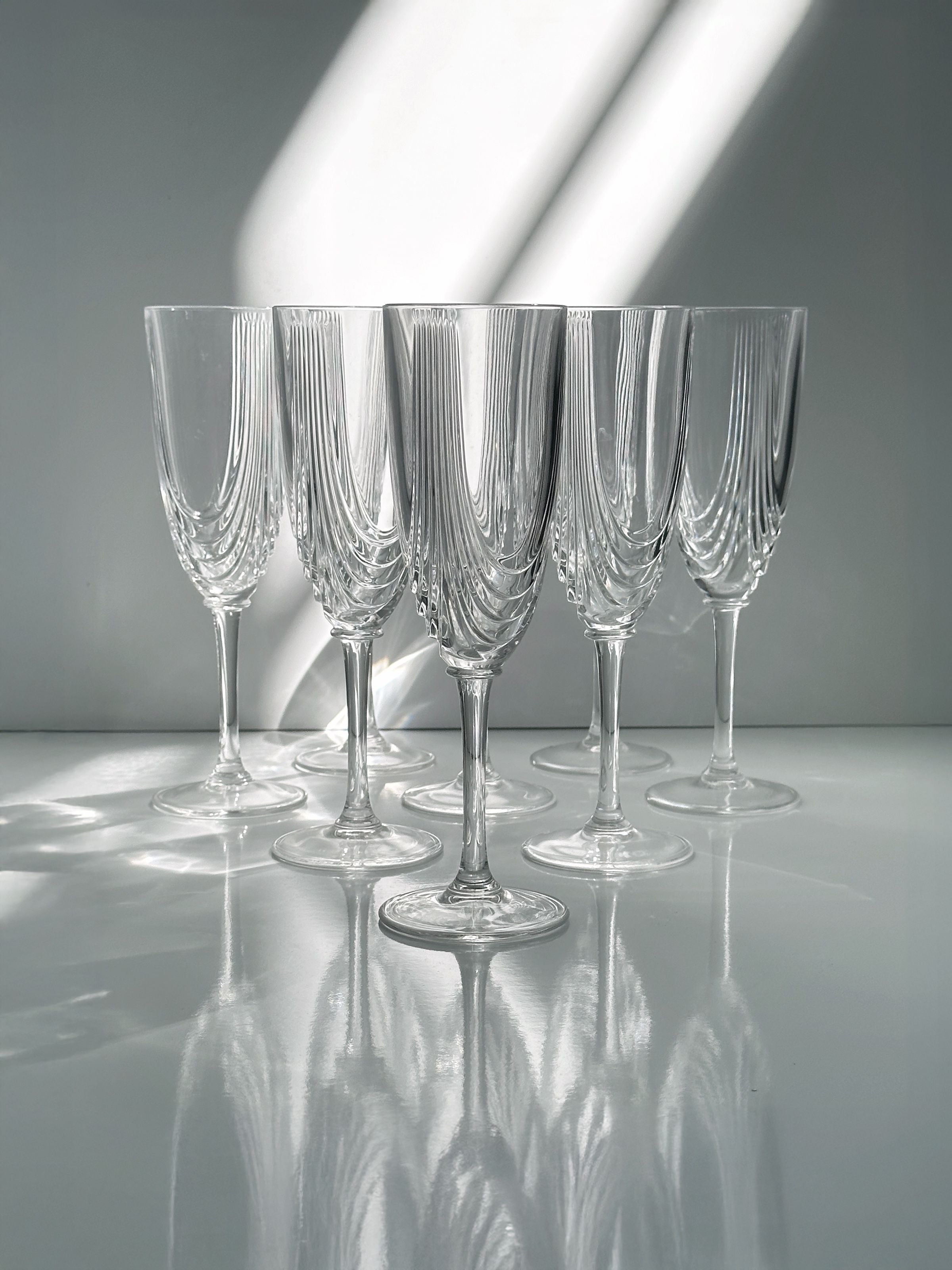 2 Italian Art Deco Crystal Glass Sets of 8 and 6 — side angle showing clear glass with ribbed design
