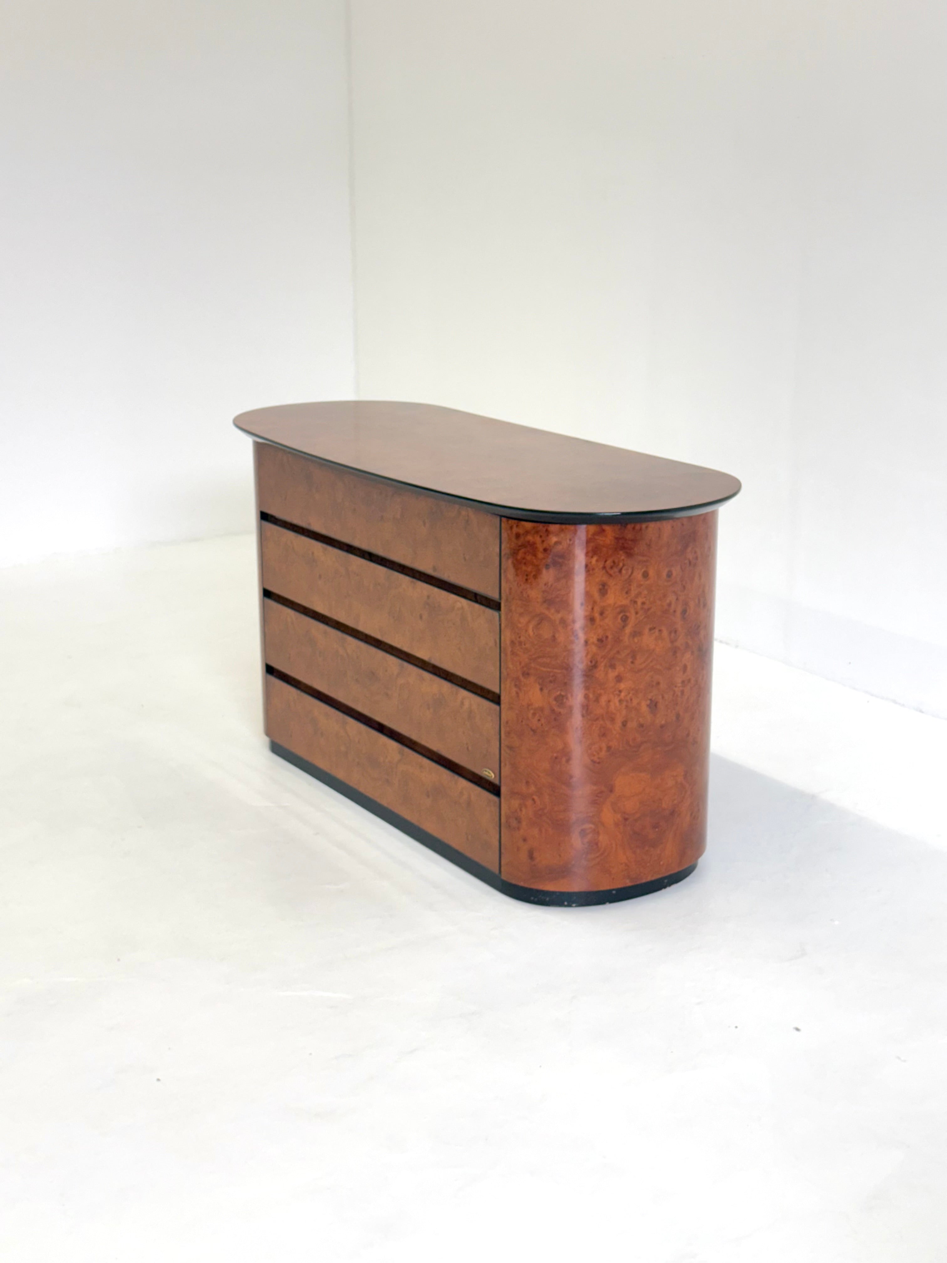 Vintage Voltan chest of drawers made of lacquered burl wood with bar — close-up