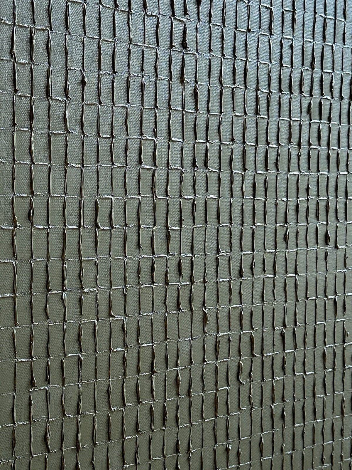 Textured olive green painting with raised square pattern detail