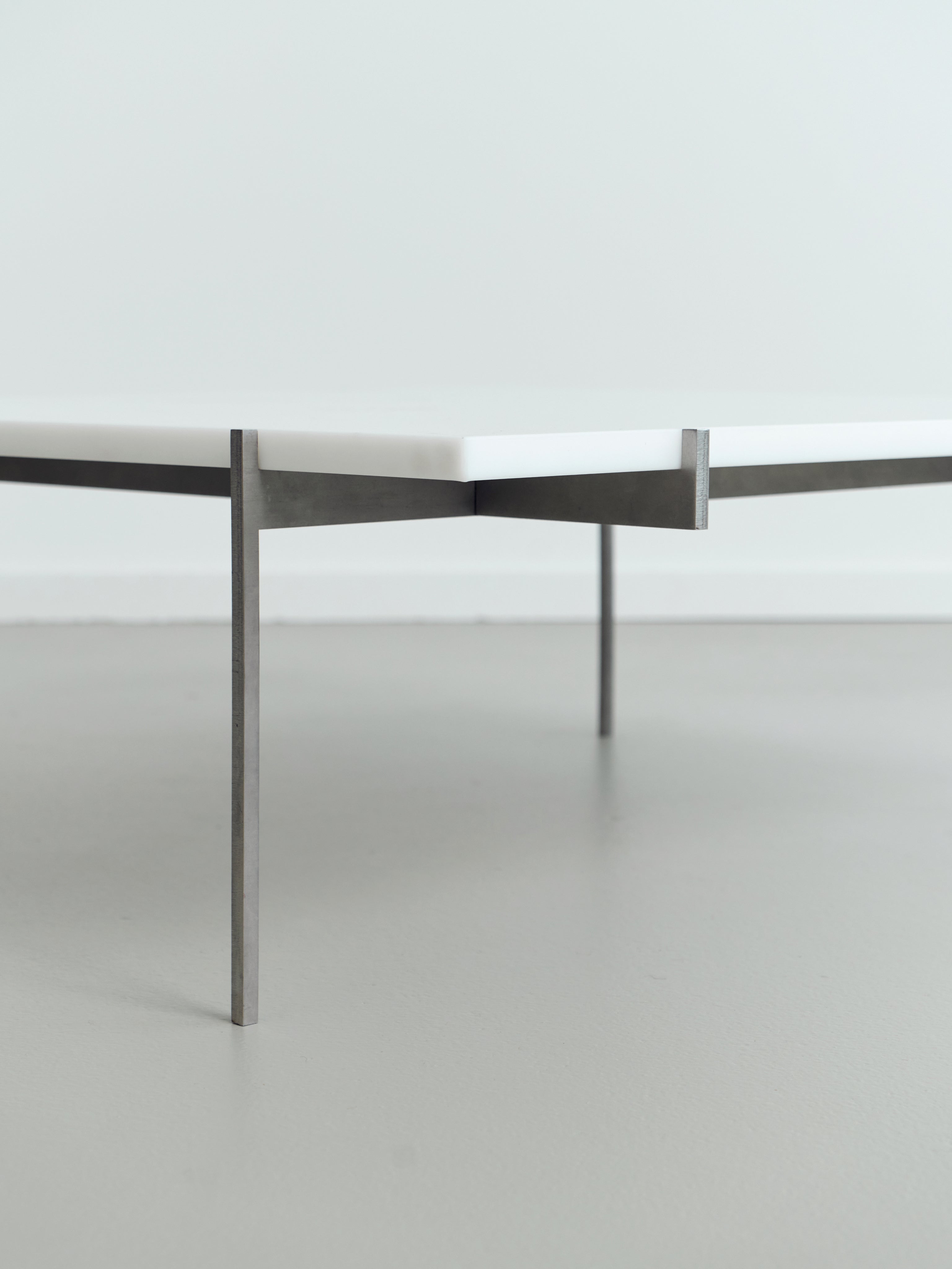 Lightweight Lounge Table — side angle showing white top and metal legs