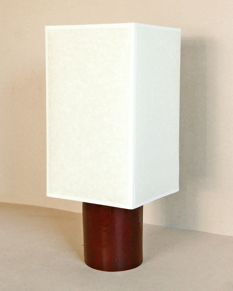 Pandora Lamp (Oxblood) — close-up of white shade and oxblood base