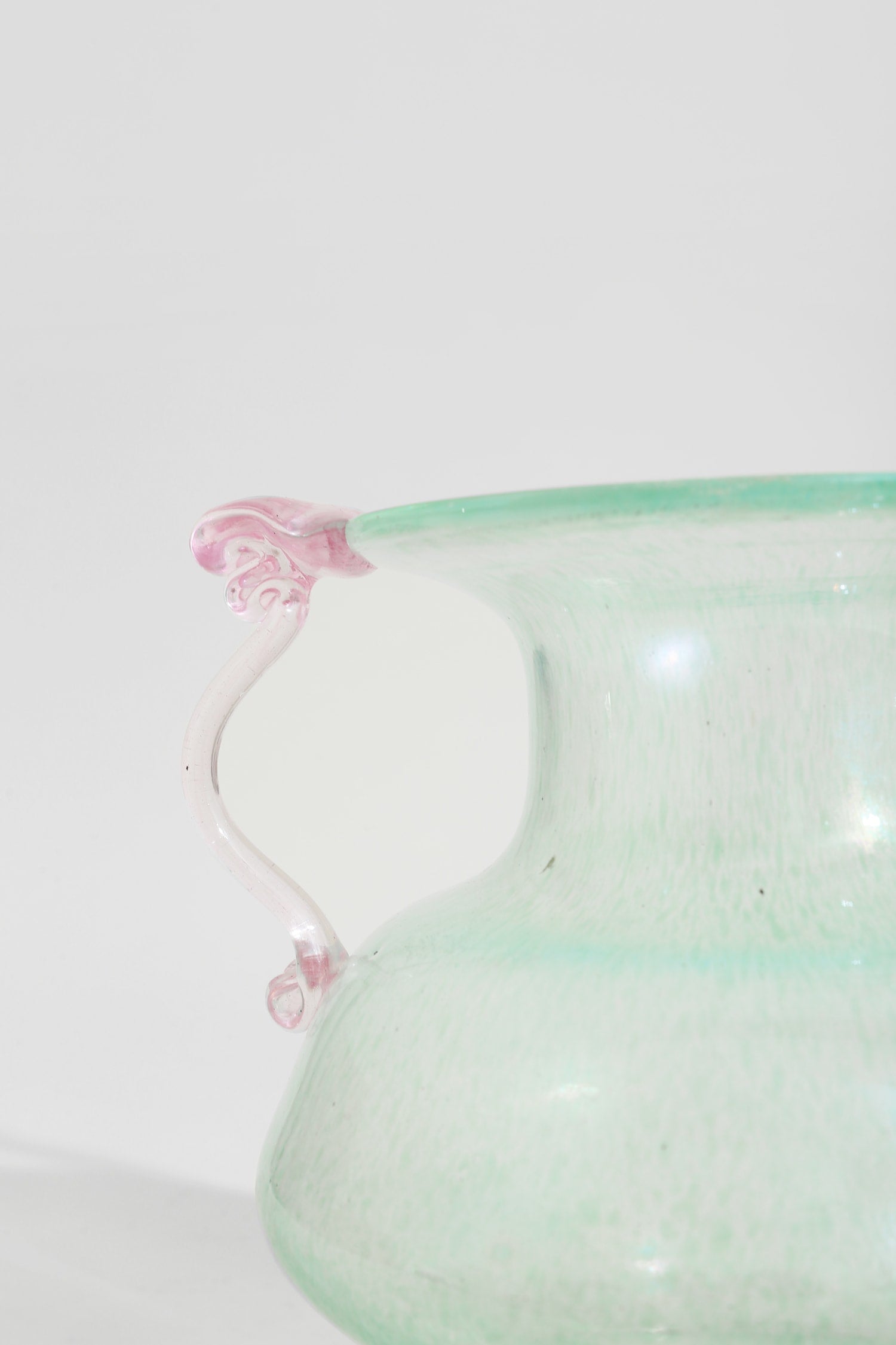 Italian Murano Glass Amphora — close-up of green glass with pink handle