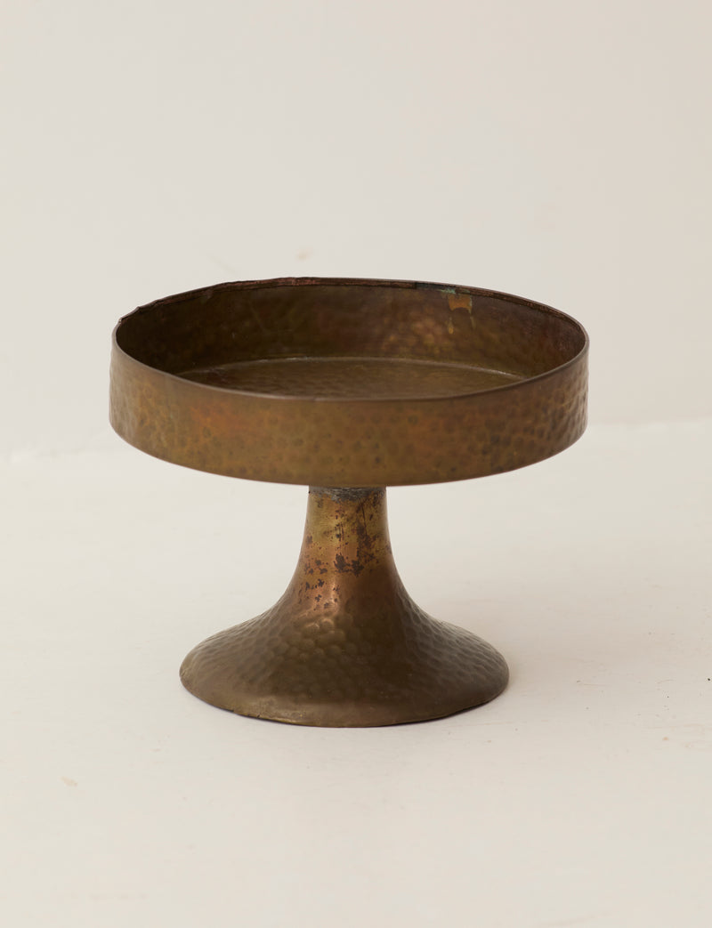 Metal Pedestal Bowl — close-up of hammered brass surface
