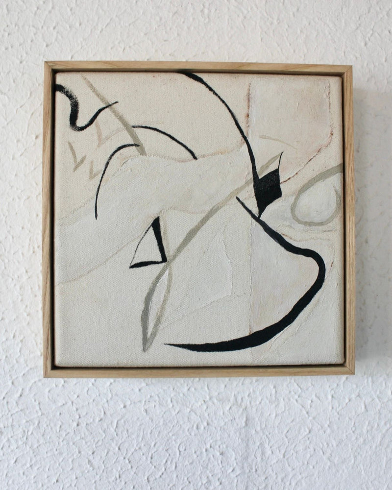 Abstract contemporary painting with flowing black brushstrokes on cream canvas