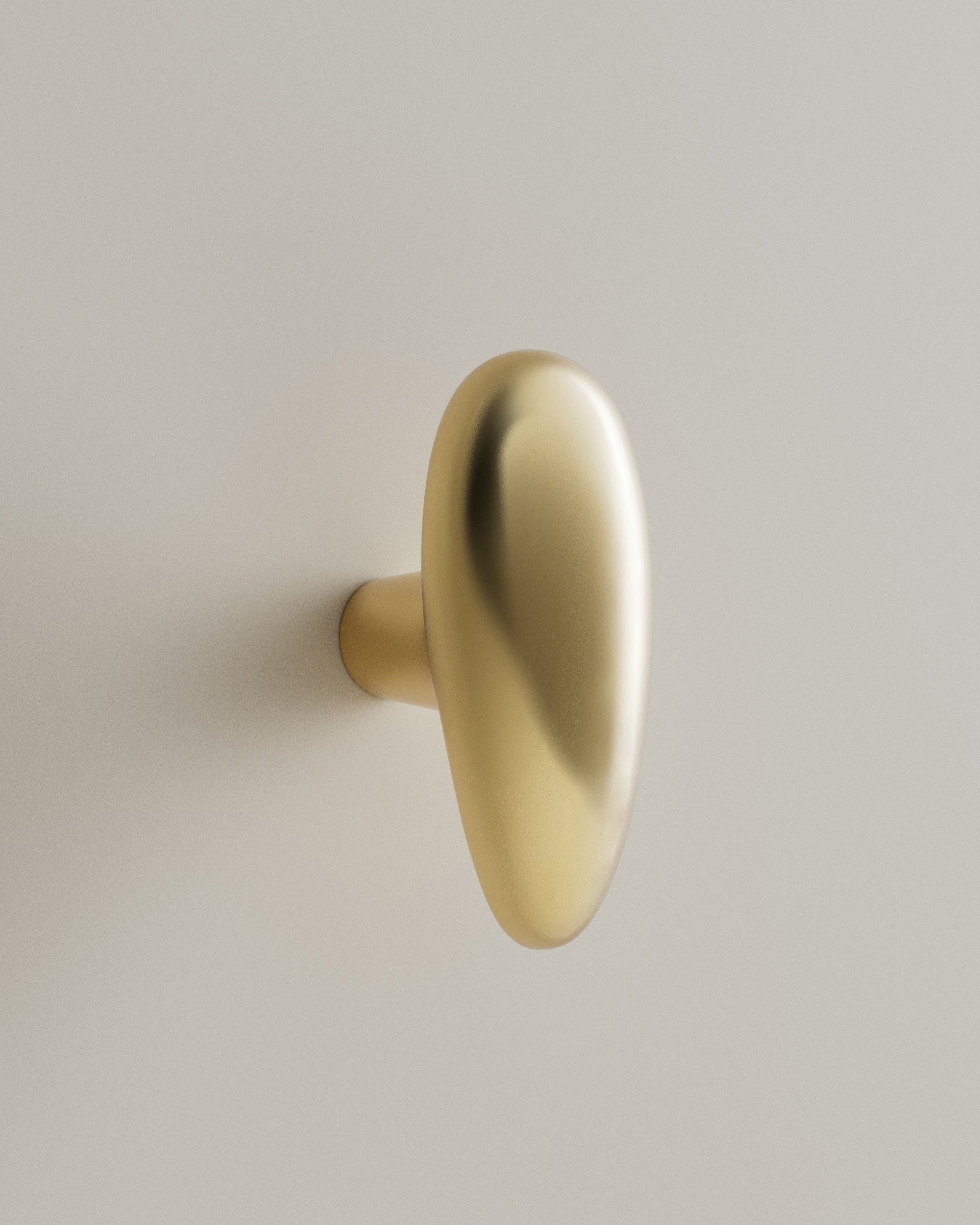 MOMI Knob/Hook Long — angled view of polished brass finish