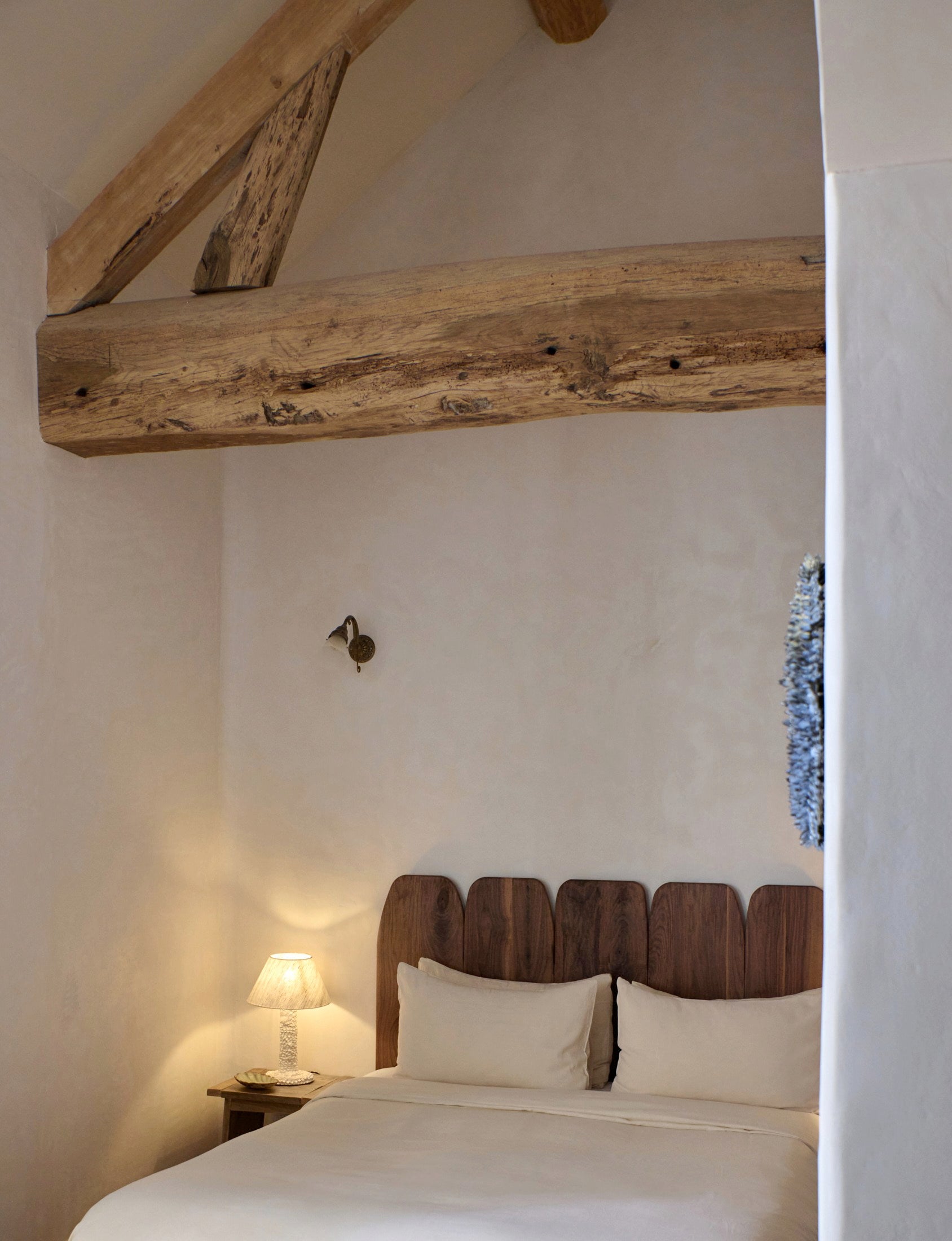 Casa Bedside Light — illuminated on wooden nightstand in cozy bedroom