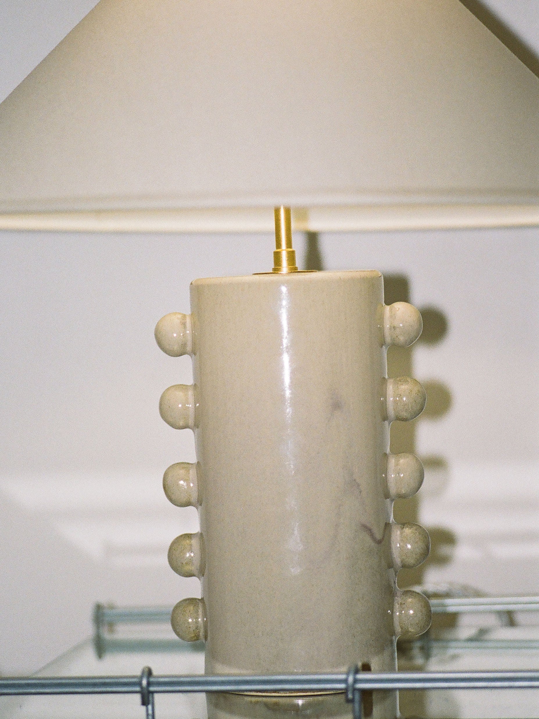 Nicola' Table Lamp — close-up of ceramic base with round accents