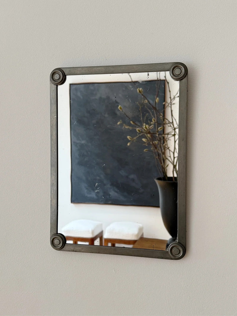 Pewter Mirror, FAK Svenskt Tenn — close-up of mirror frame with wall art