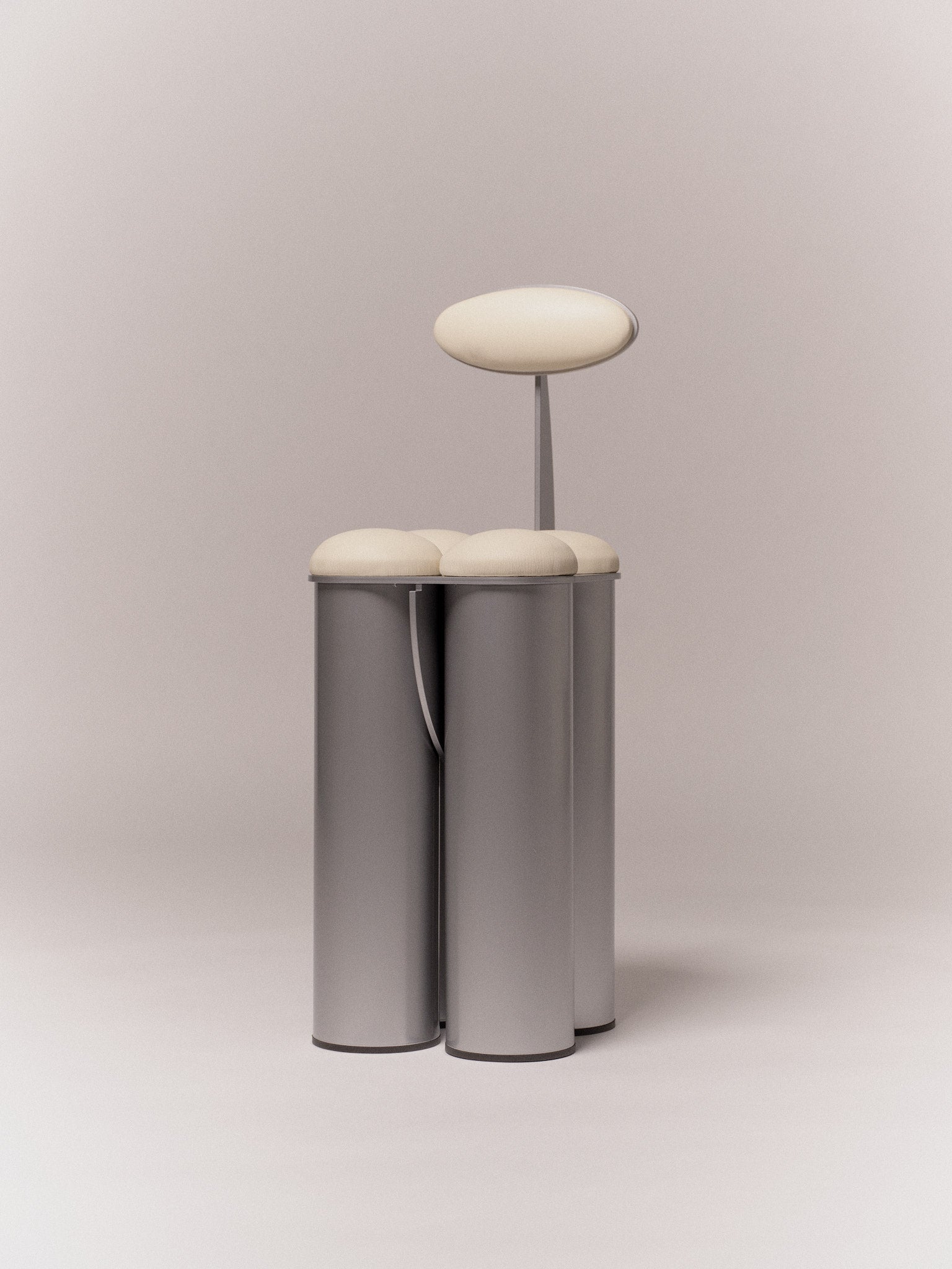 Giulio Stool — side view of modern metal design with cream seat
