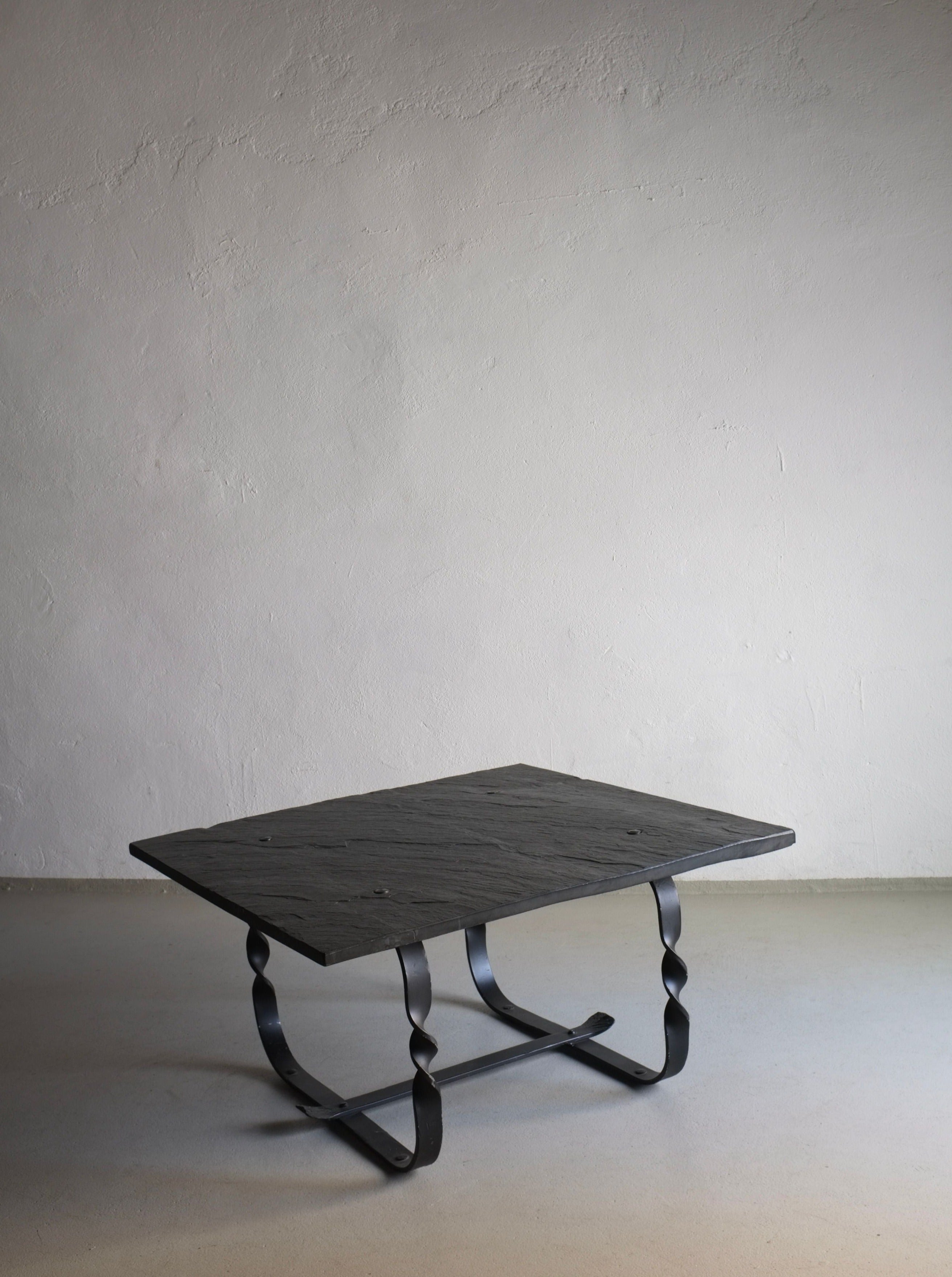 Brutalist Coffee Table 1970s — side angle showing black stone top and metal base
