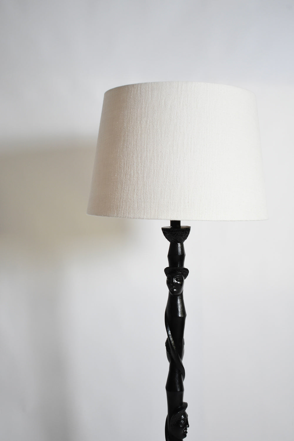Africanist ebonised wood floor lamp, 1970s — detail view