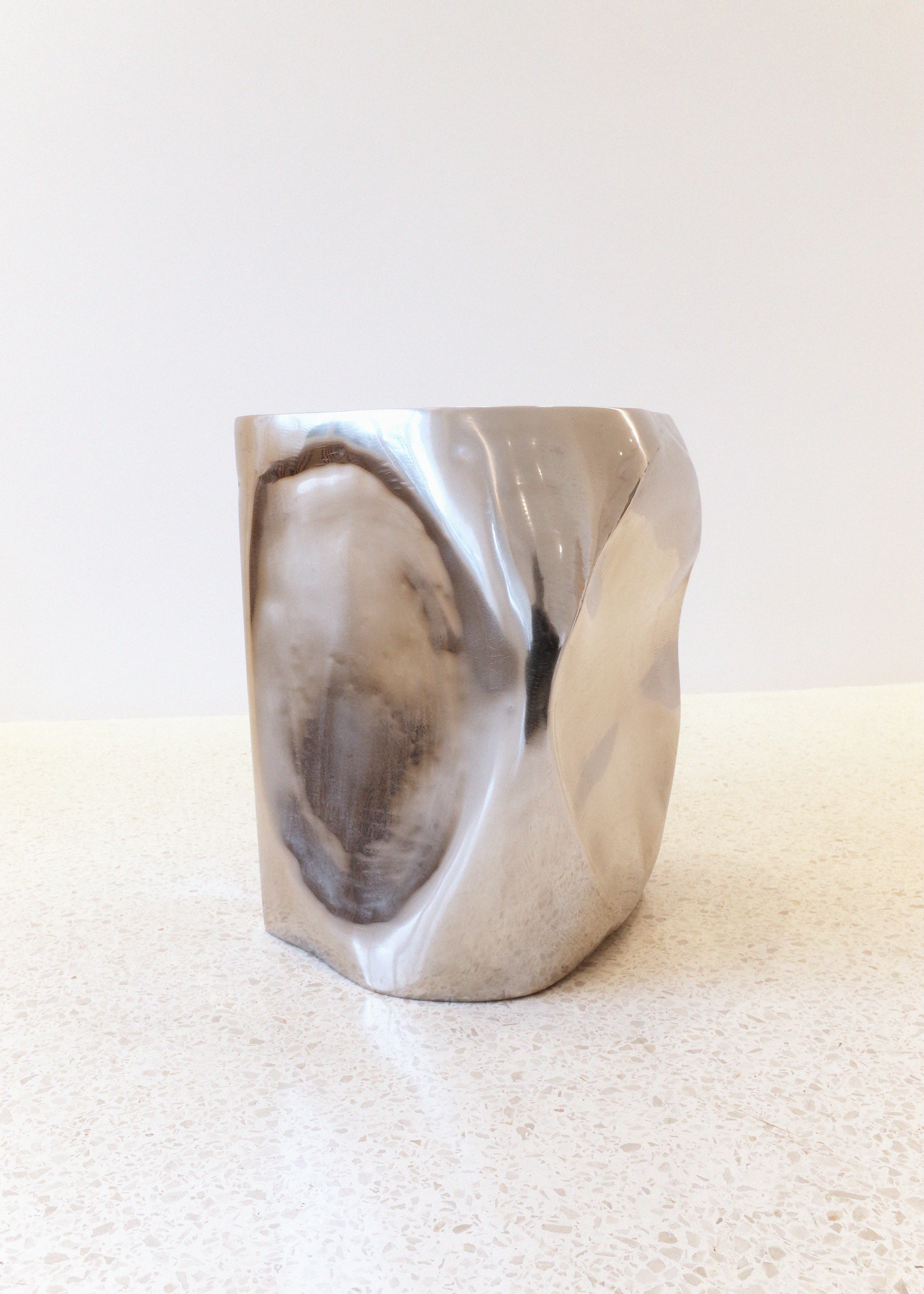 The ROCHER Small Table in Polished Stainless Steel
