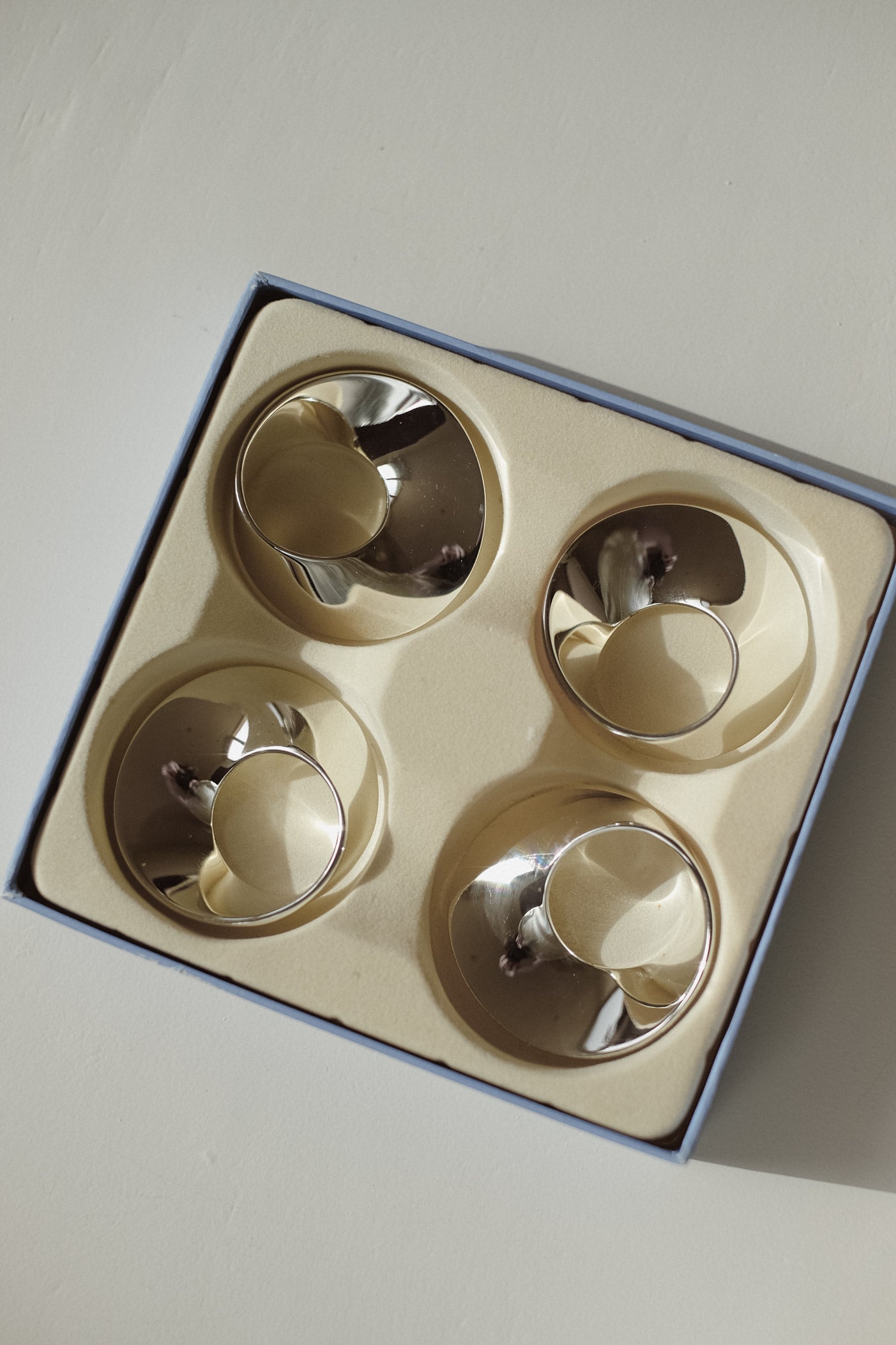 Set of 4 Silver-Plated Napkin Rings — back view in gift box