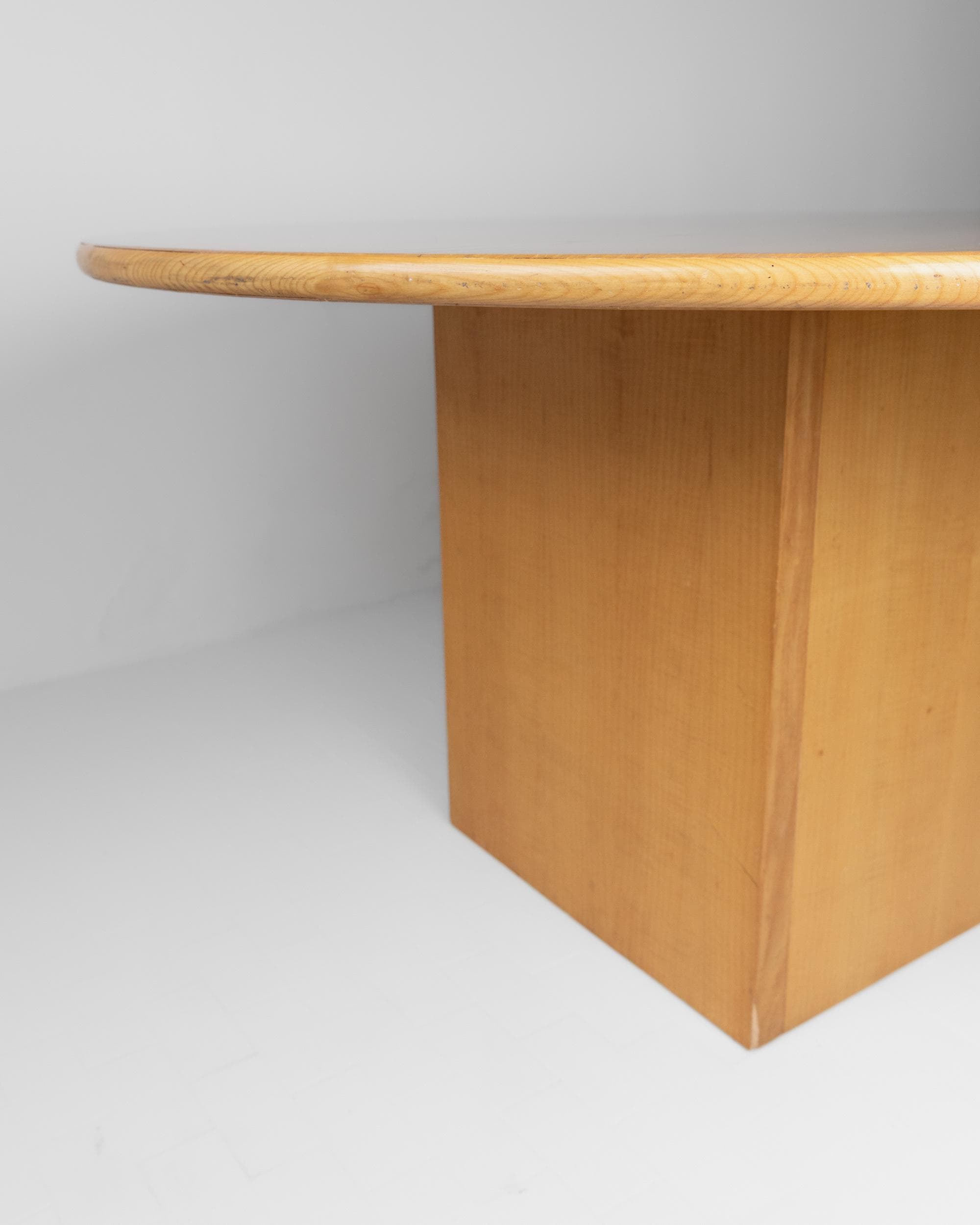 1980s Large Round Wooden Table — angled view of light wood base