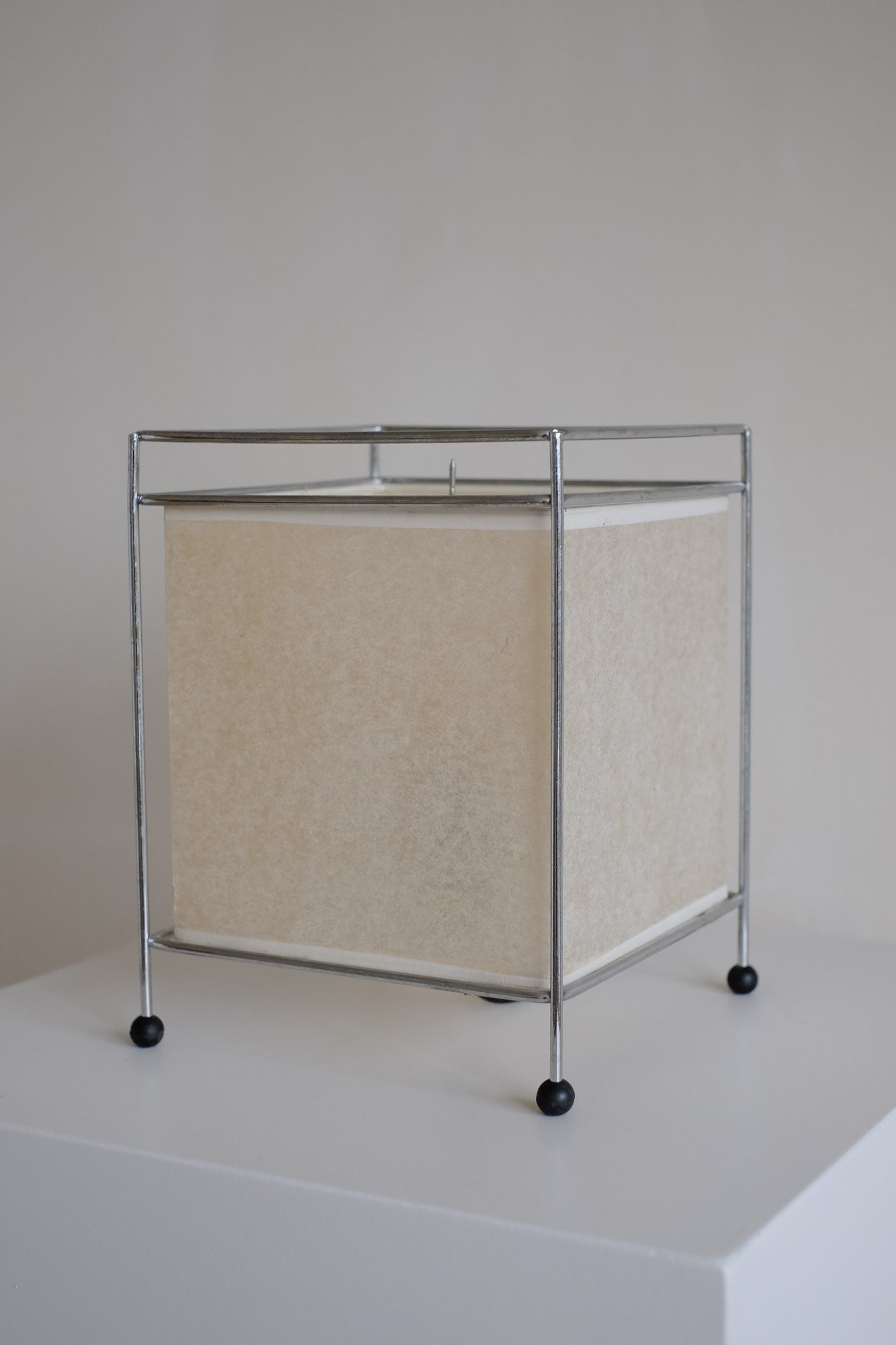 Japanese Rice Paper Table Lamp — angled view on white pedestal