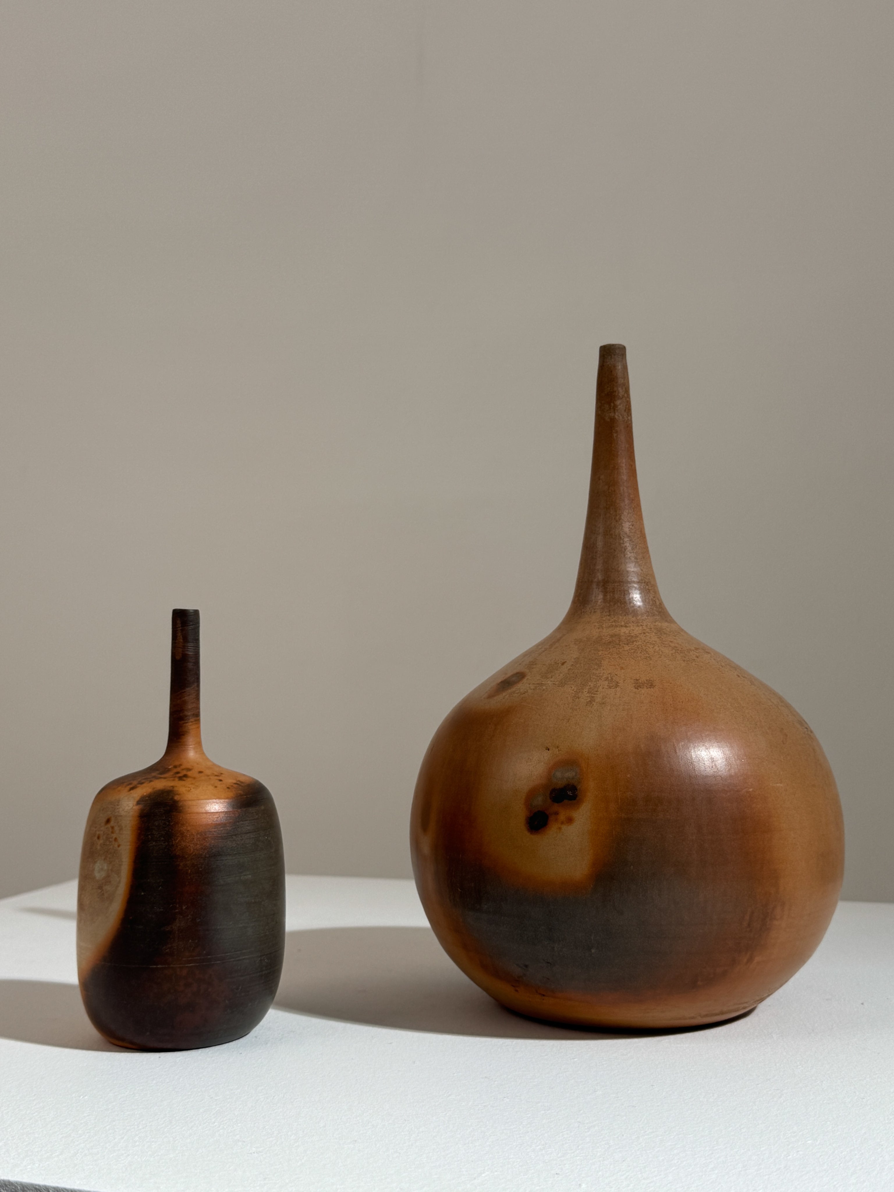 Two ceramic soliflore vases by Pierre Bayle with earth-tone glazes