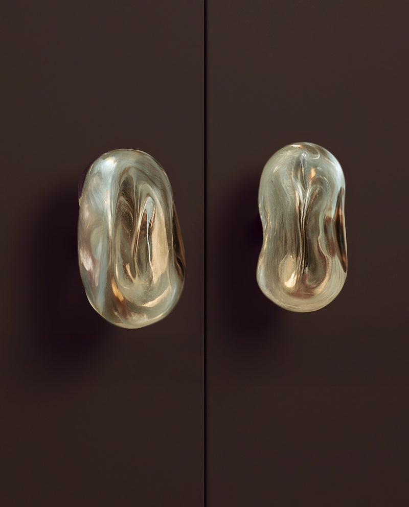 Knobs Collection Sculptures in Glass — close-up of glass knobs on dark surface