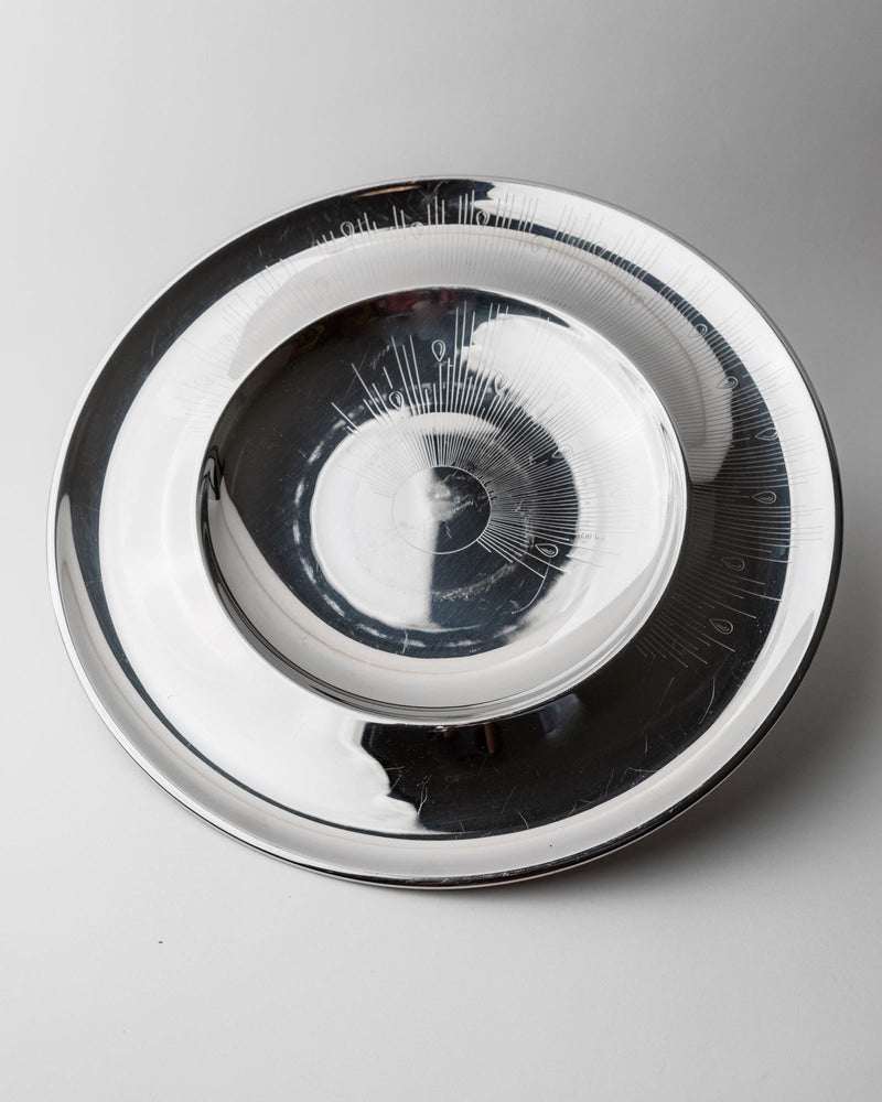 1980s Stainless Steel Plate — top view showing circular design and reflections