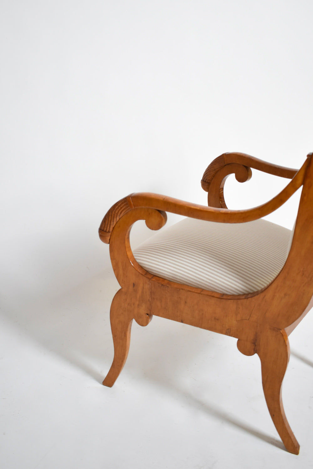 Pair of Etruscan Armchairs, XIXth c. — angled view highlighting wooden armrest details