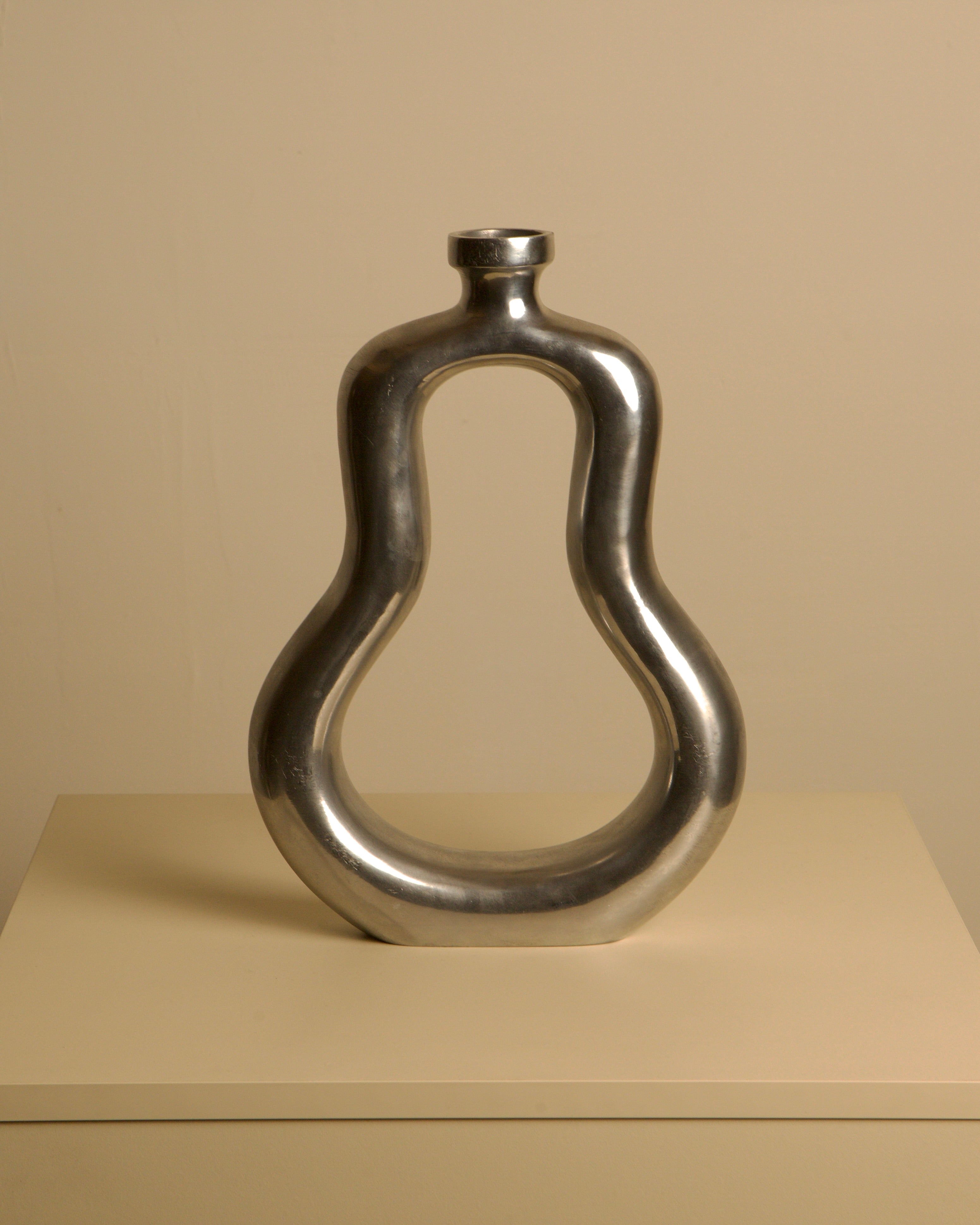 Italian cast aluminum vase 80's — front view highlighting smooth metallic finish