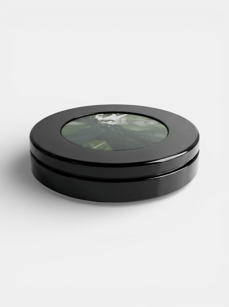 Yoyo Black And Avocado Marble — close-up of round black table with marble top