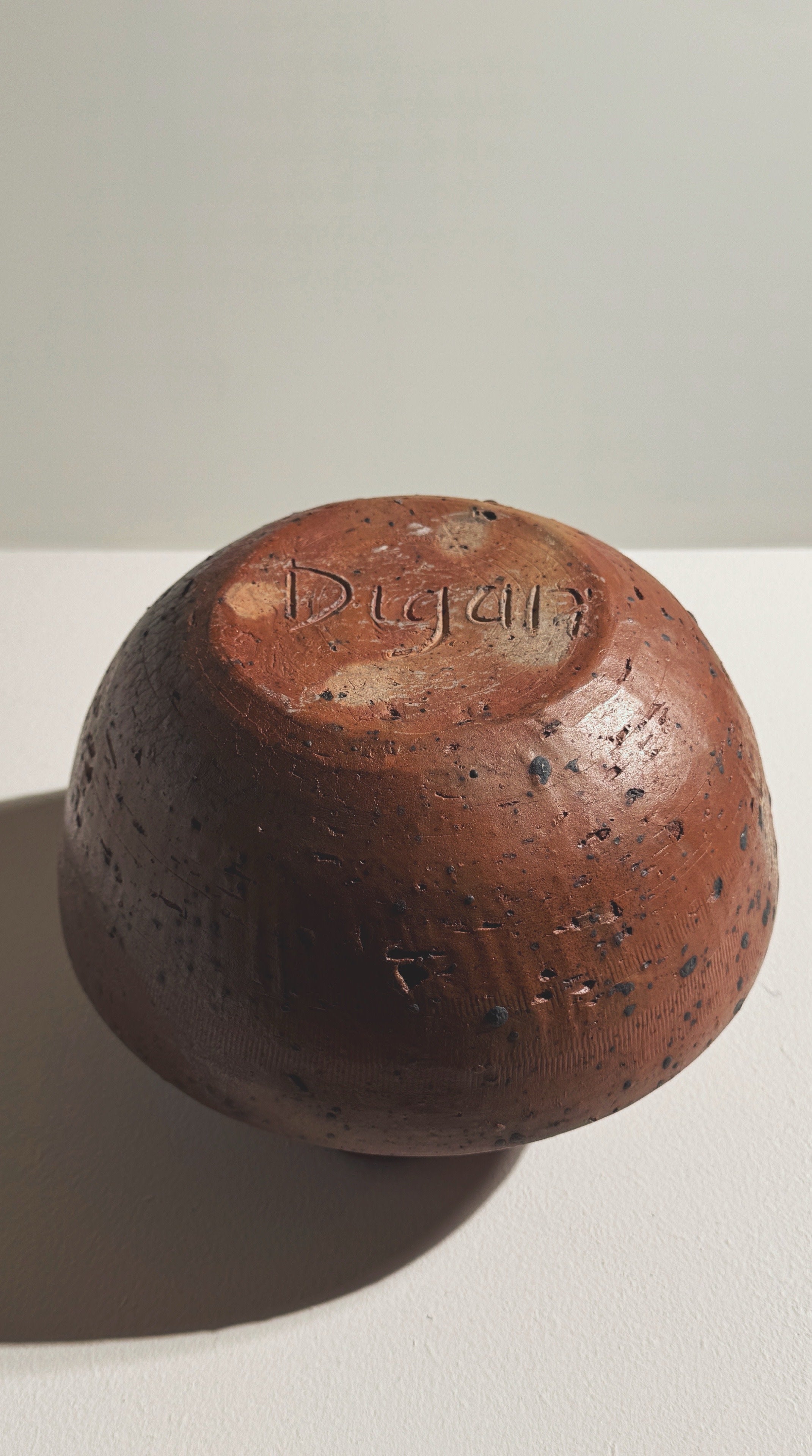 Bottom view showing Pierre Digan signature on stoneware pitcher