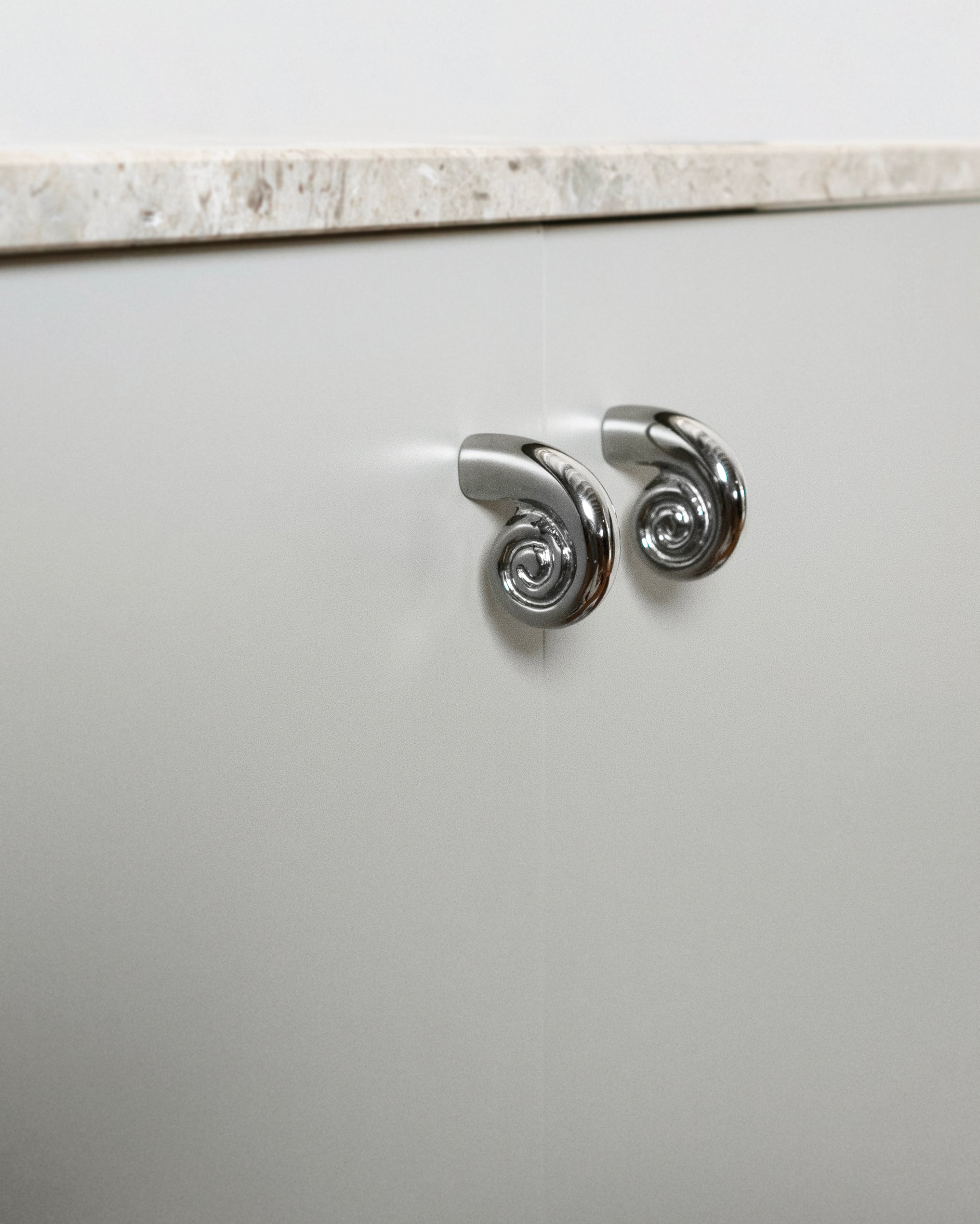 Noelle Knob - Titanium — close-up of textured titanium surface