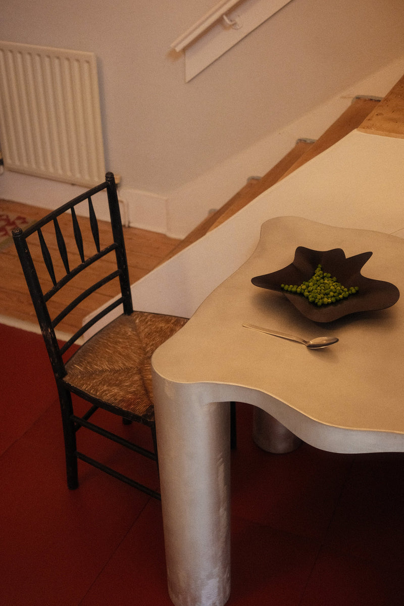 Mid Bowl BLACK — side view on modern table with green grapes