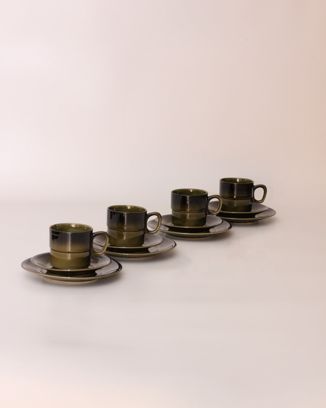 Set of Four Ceramic Cups — angled view on simple white background