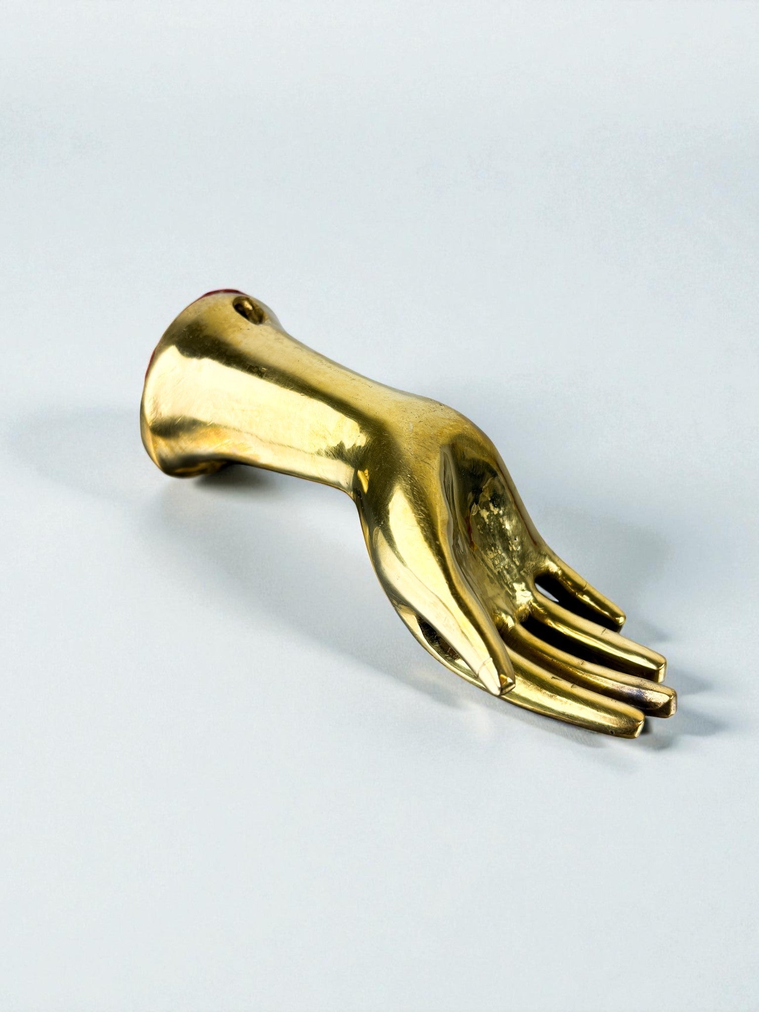 Bronze Hand-Shaped Wall Hook, Gilded Finish, Italy, 1970s — angled view on light background