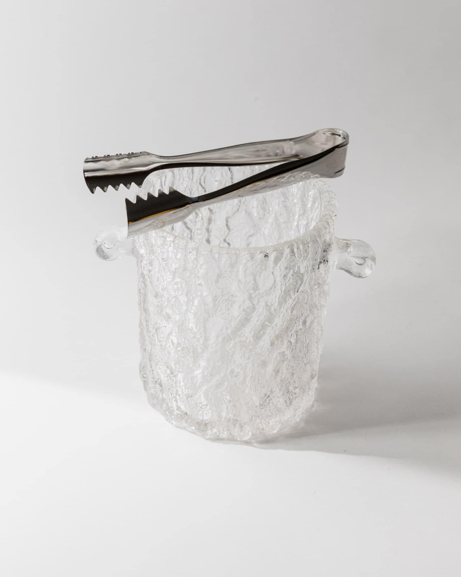 1970s Glass Ice Bucket — angled view with textured glass and metal tongs