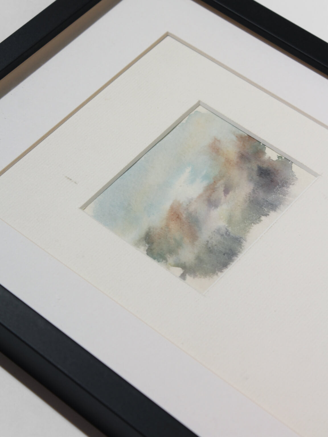 Abstract Watercolour Vintage Painting In Light Shades — angled view in black frame
