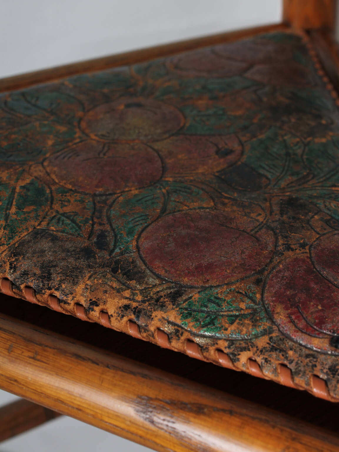 Swedish Carved Oak Monk Chair — close-up of leather seat detail