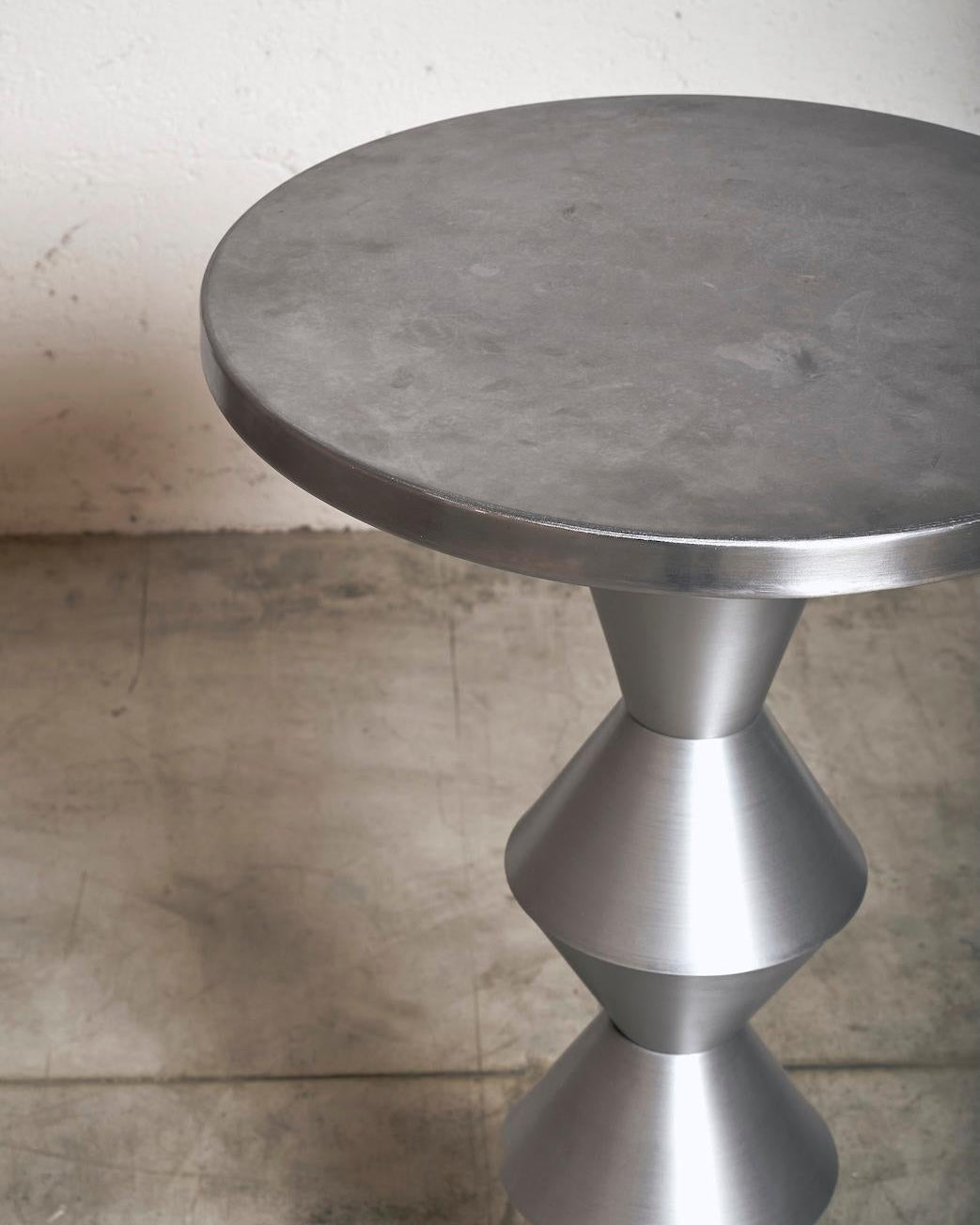 Bar Table by James Irvine for Metals Milano — close-up of brushed metal surface