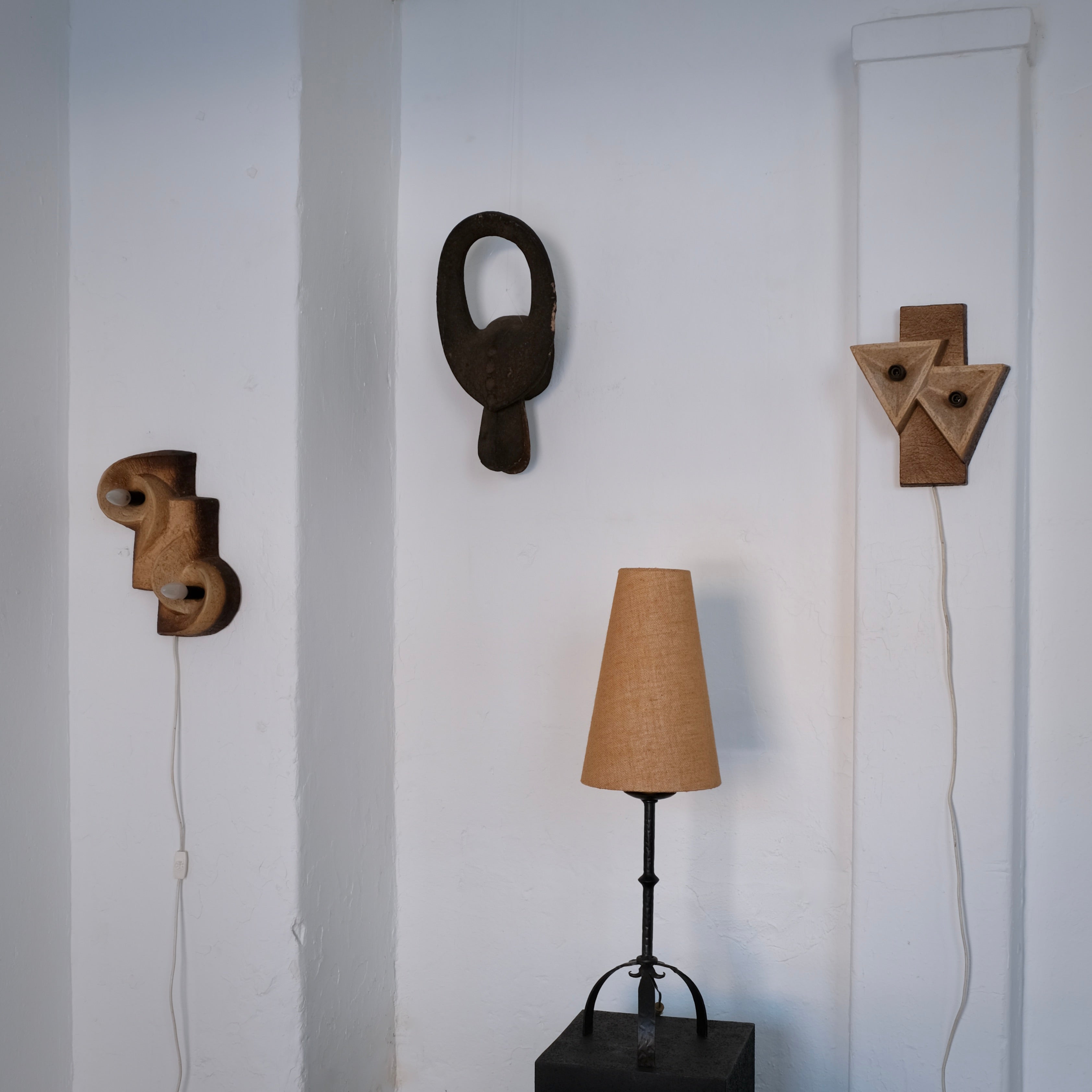 Dutch Organic Form Ceramic Wall Sconce, 1960s — textured ceramic detail on white wall