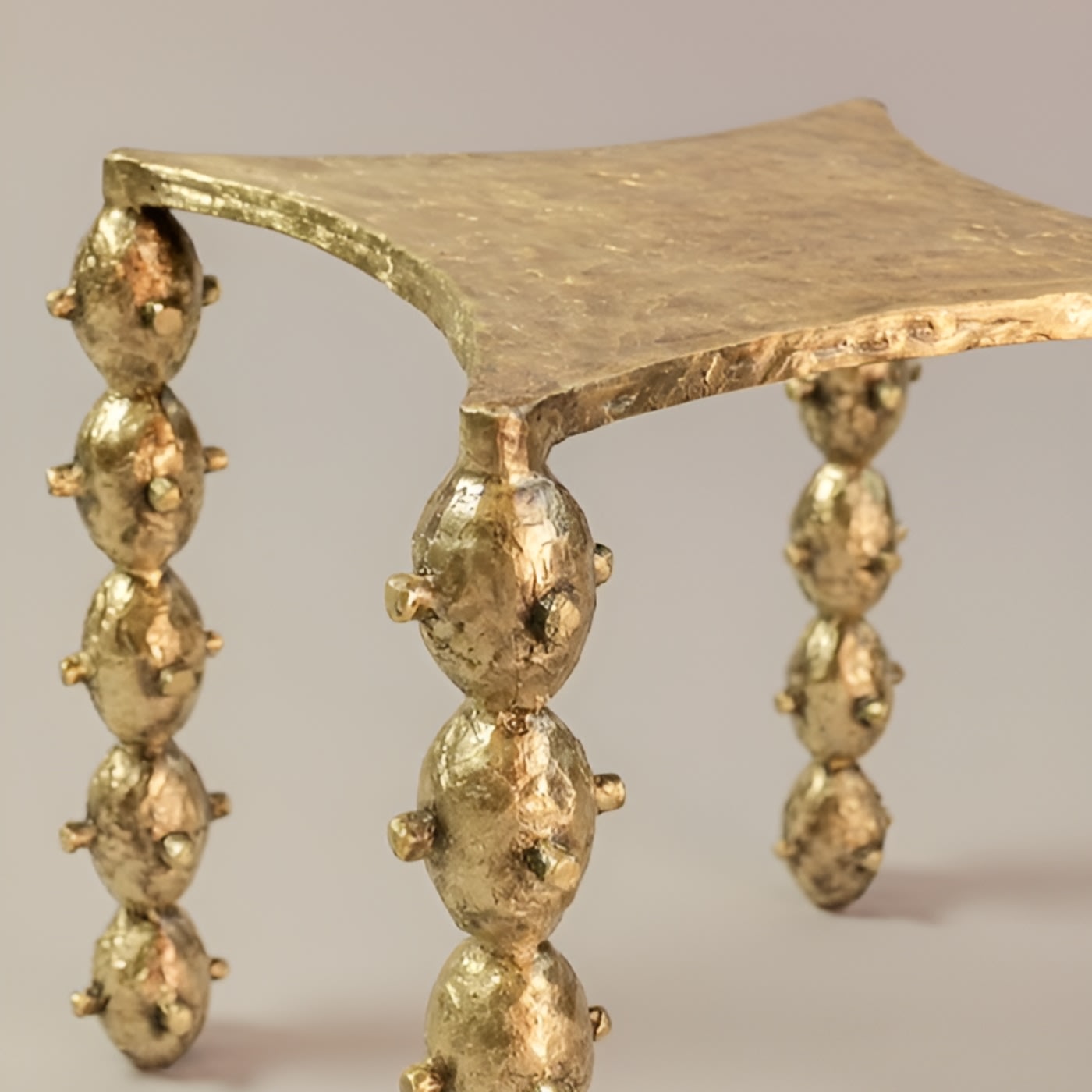 Cast Bronze Table - KABIKI Limited Edition by Daniel Couttolenc, Polished Finish — lifestyle setting
