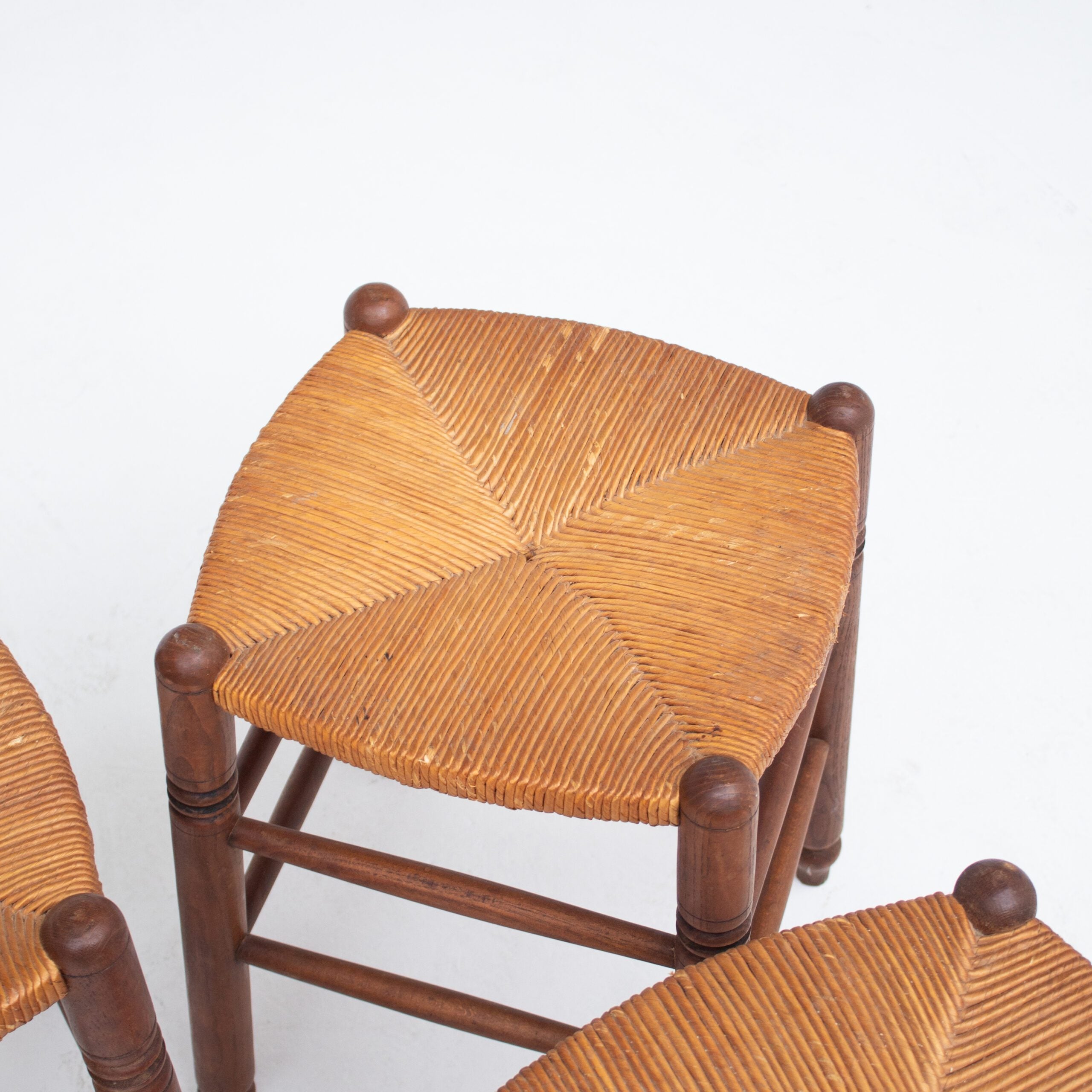 Set of 3 French Rattan Top Stools in Solid Wood — top view of woven rattan seat