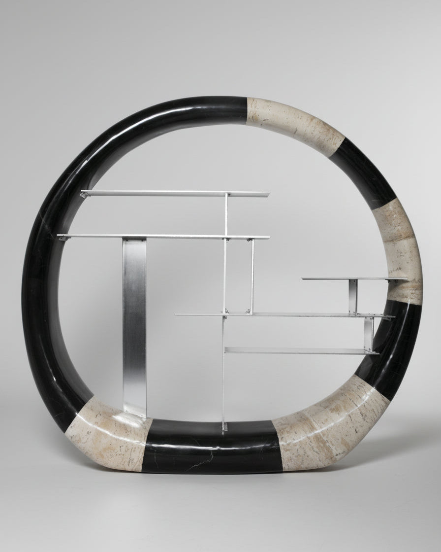 The Panorammma Asymmetric Stone Ring Shelf features a circular stone frame with alternating black and beige marble and minimalist silver metal shelves in an asymmetrical design, displayed against a light gray background.