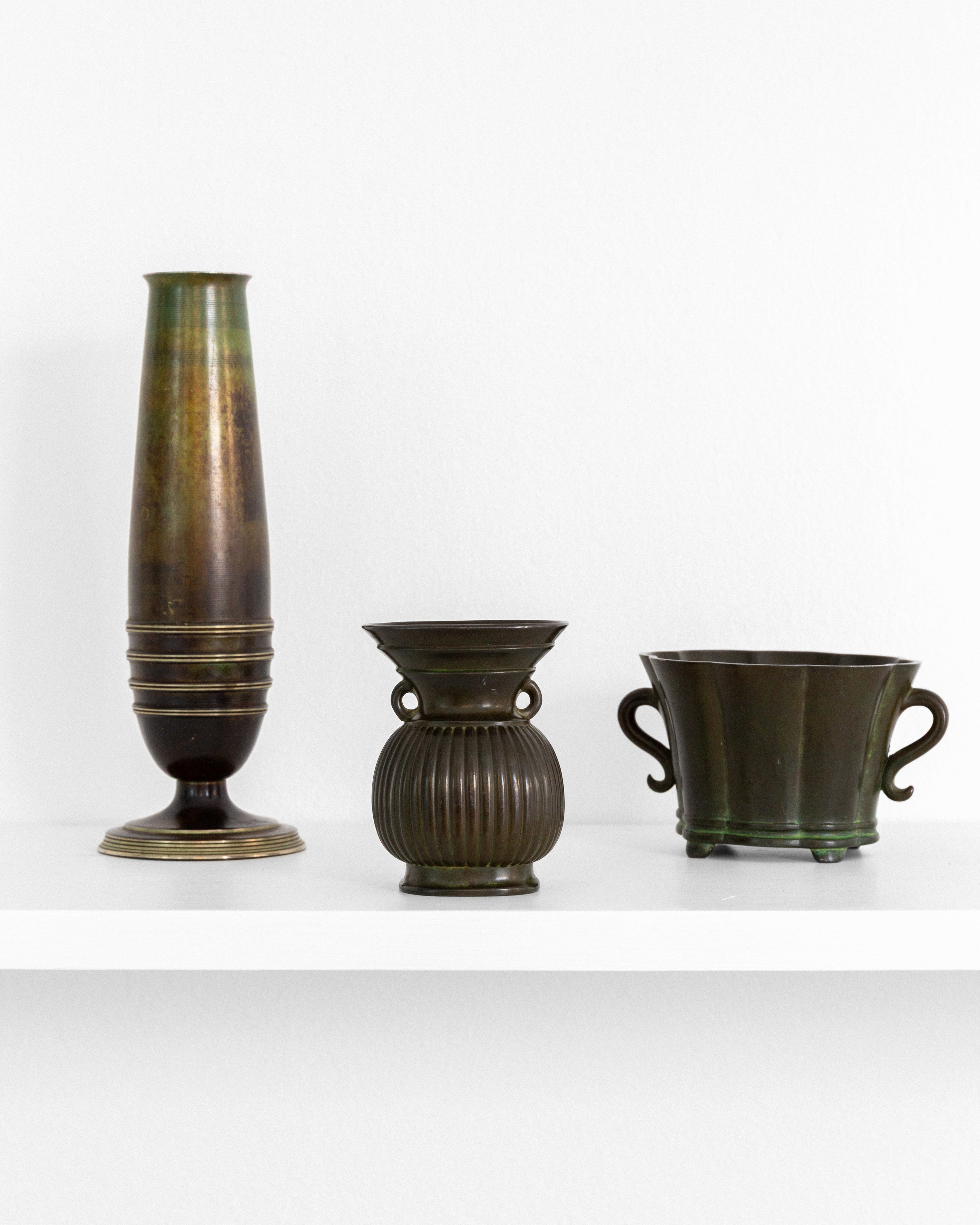 Pair of Modernist Brass and Bronze Vases — top view on white shelf