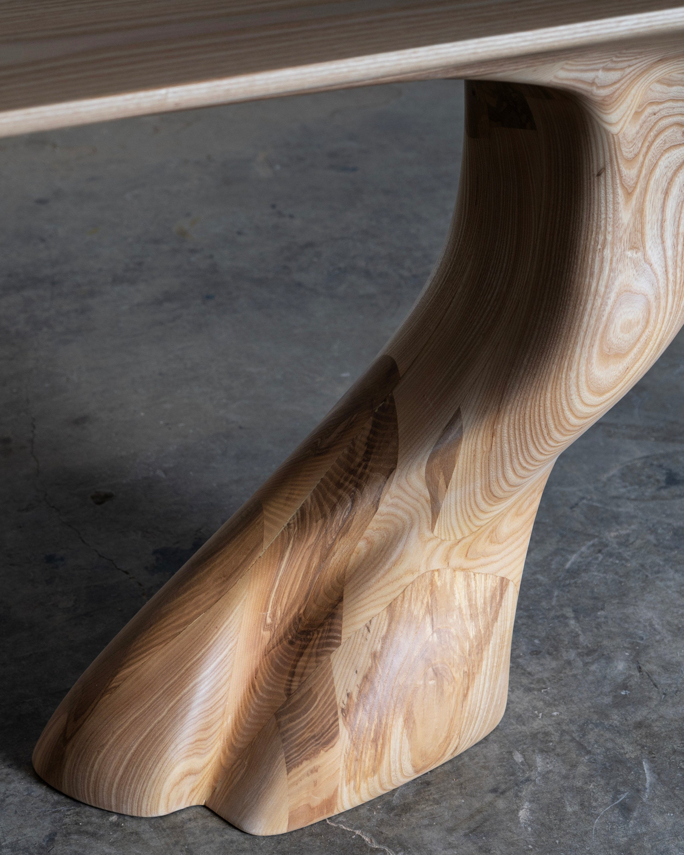 Wood and Walnut Table - Frolic Contemporary — close-up of curved wooden leg