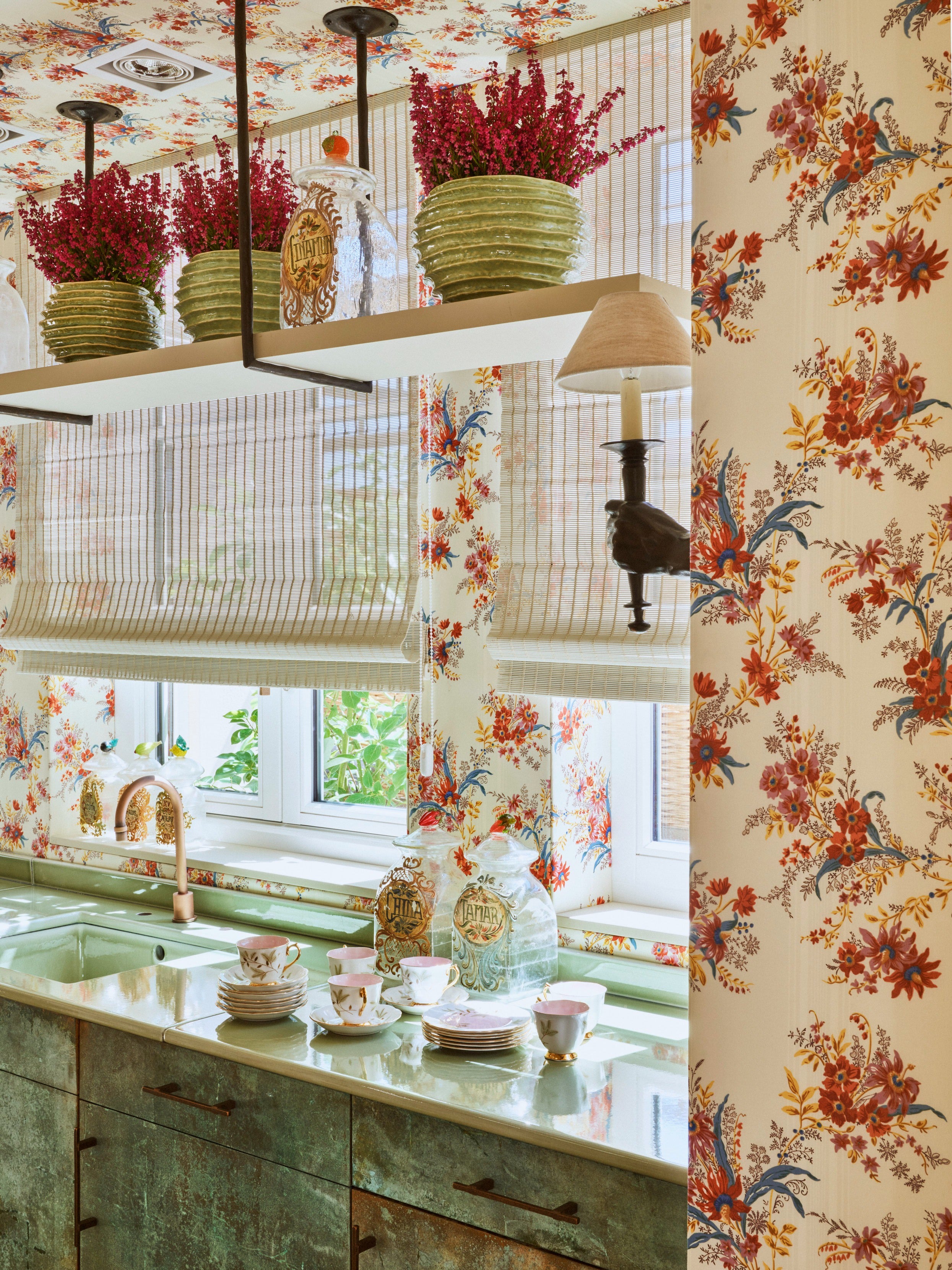 Hand-Torch Wall Light — back view against floral wallpaper in kitchen