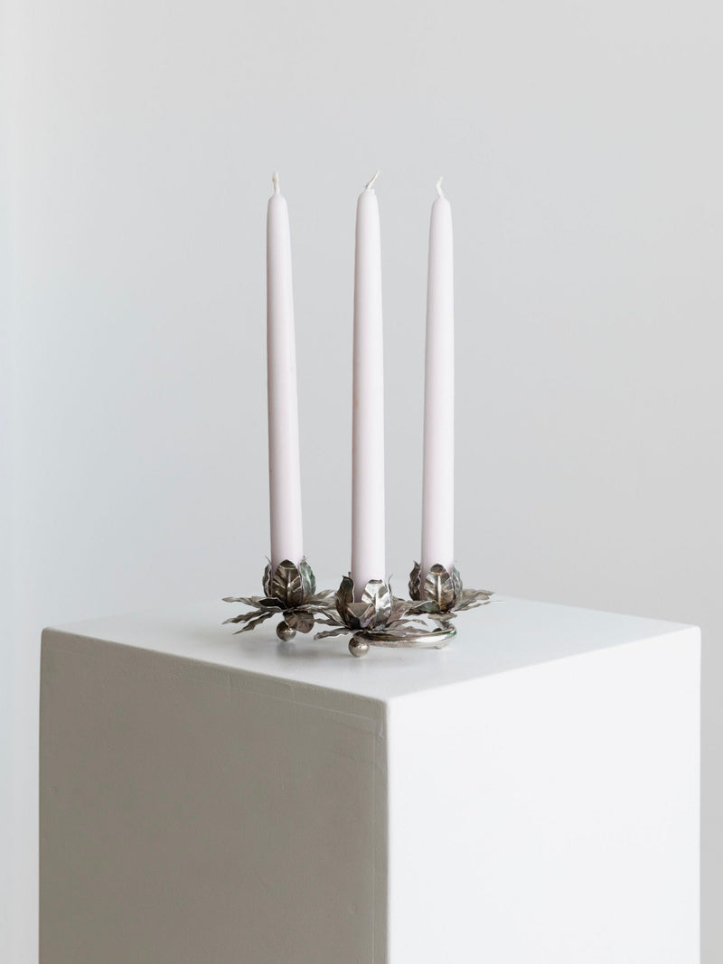 Silver Plated Vintage Candleholders — close-up of candleholders on white pedestal