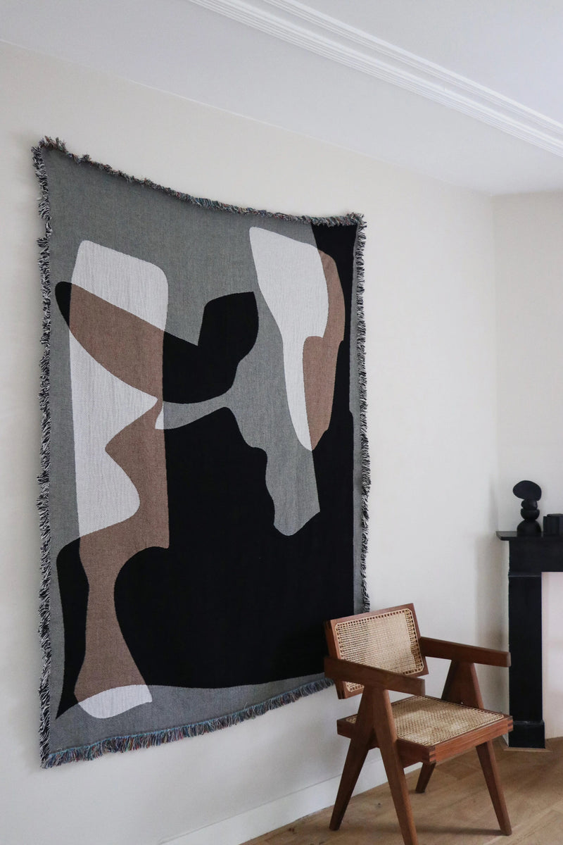 Abstract geometric jacquard throw with black, brown and white shapes