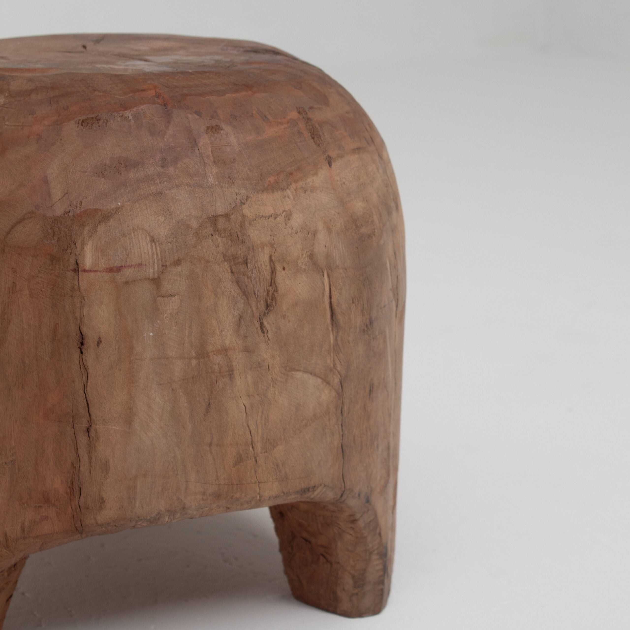 Sculptural Solid Wood Stool in Warm Natural Patina — side angle