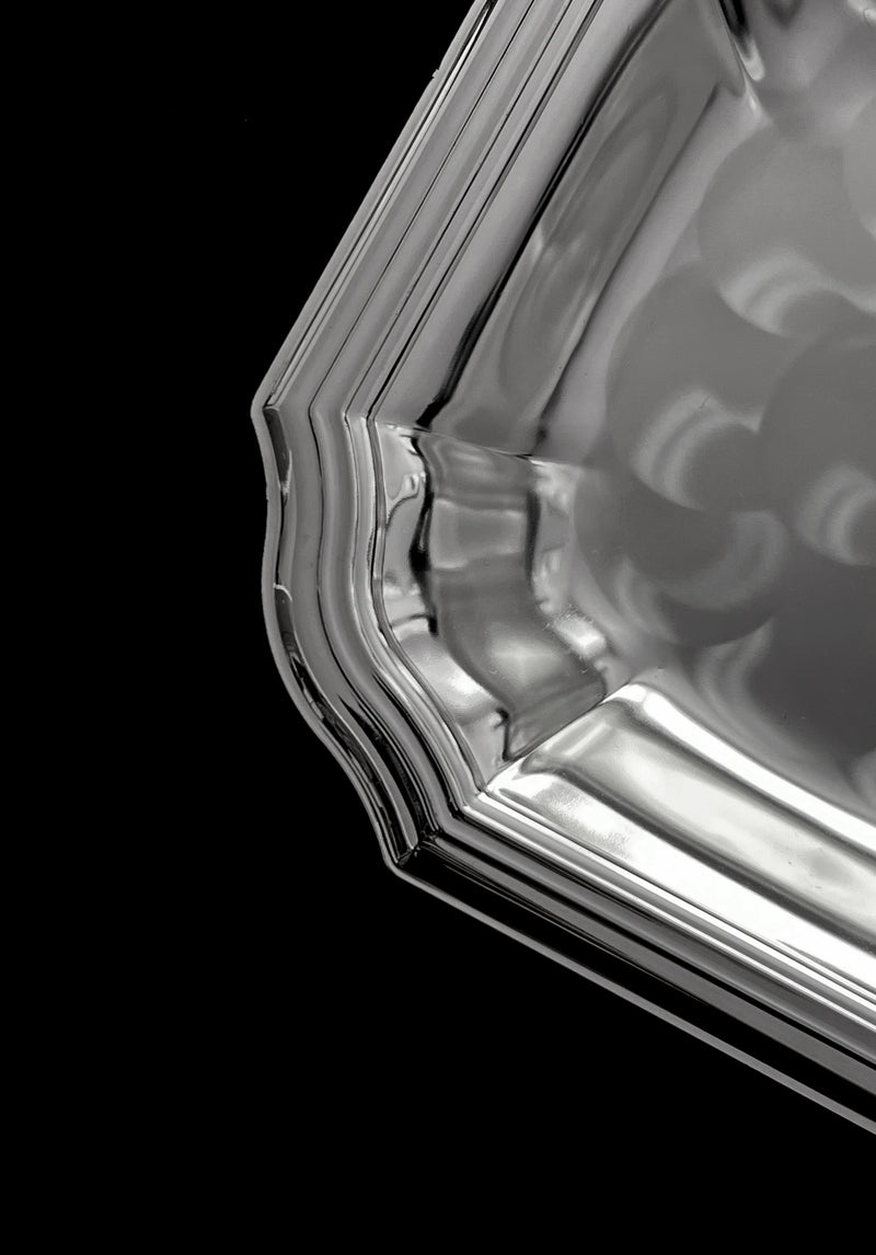 Detailed rim and curved edge of vintage silver-plated dish