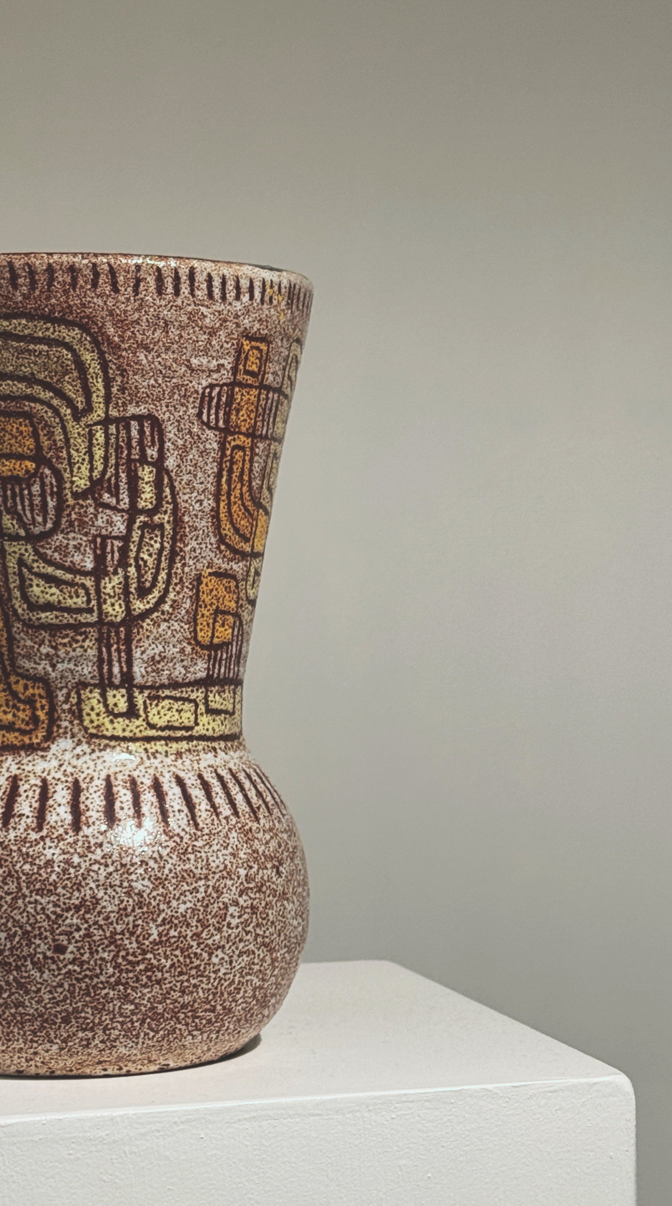 Close-up detail of geometric patterns on vintage Accolay ceramic vase