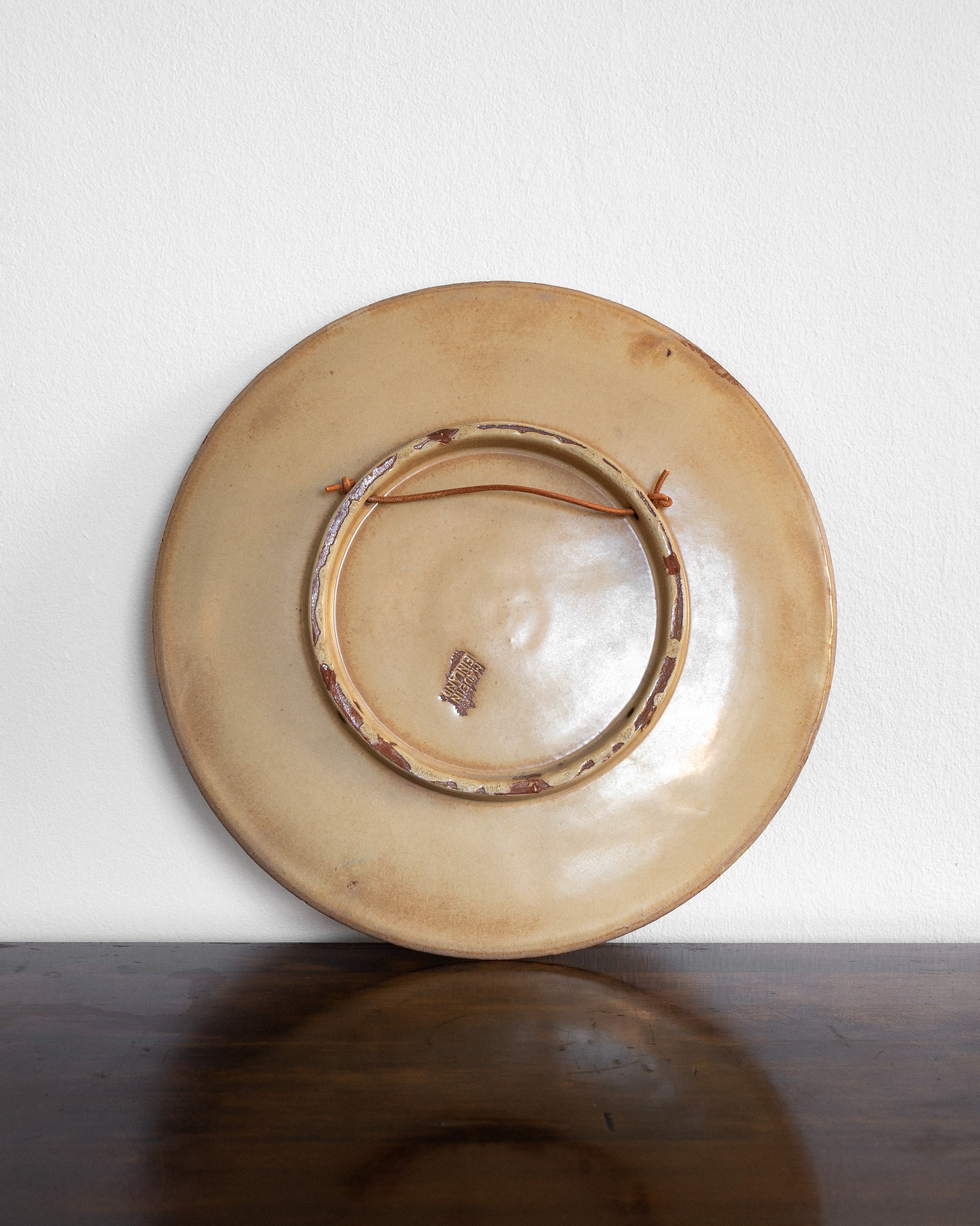 Large Art Deco Wall Plate by Wäinö Aaltonen, 1930s — top view showing earthy tones and hanging loop