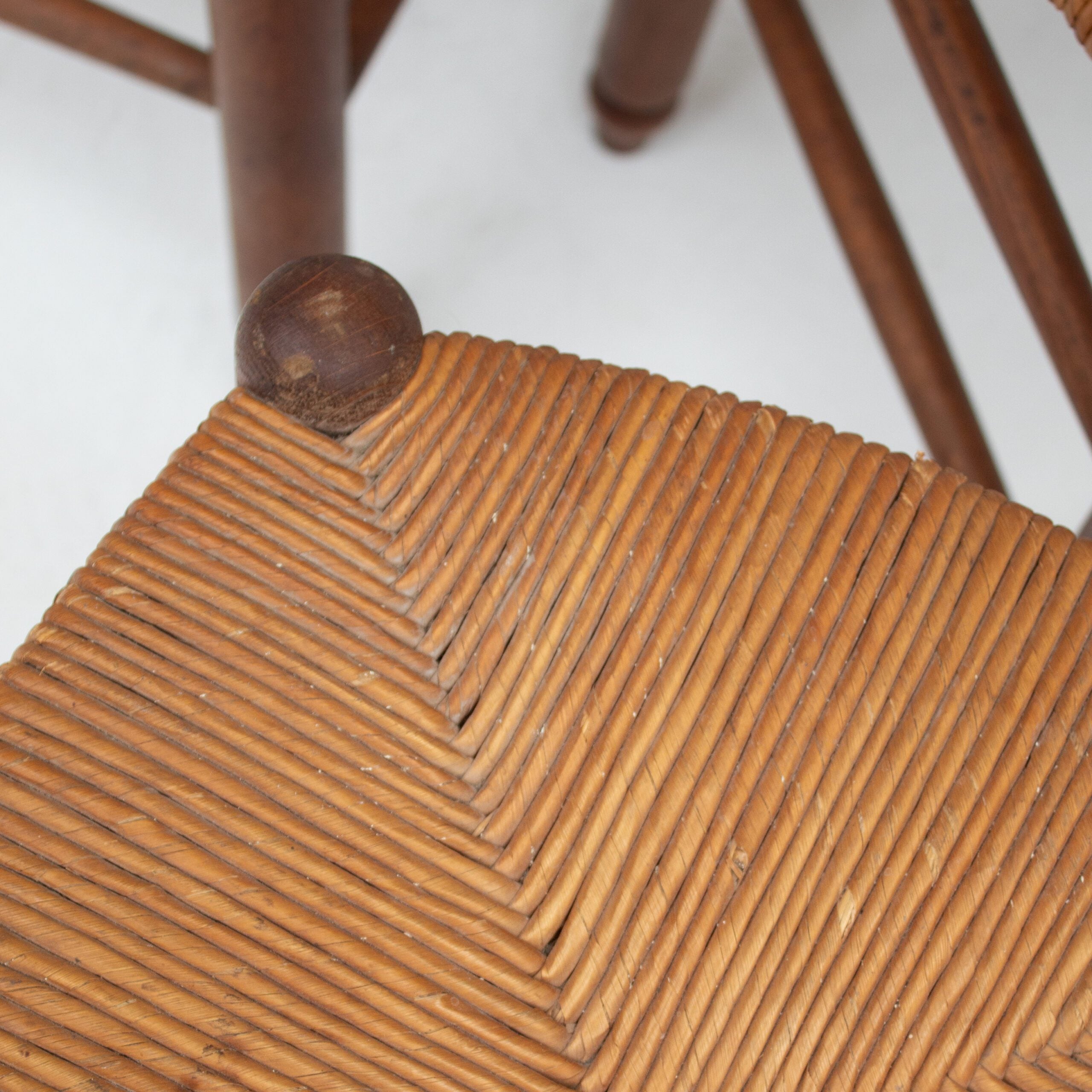 Set of 3 French Rattan Top Stools in Solid Wood — top view of woven rattan seat