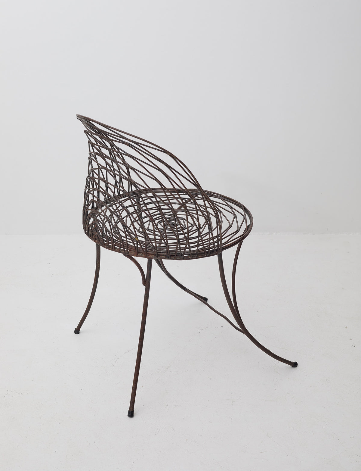 French 20th Century wrought iron armchair — side angle